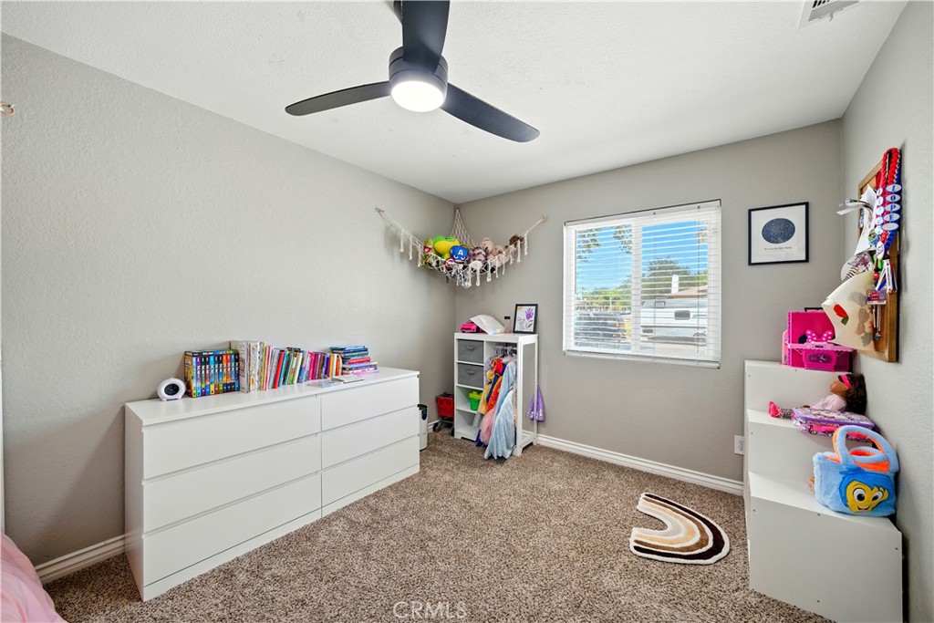 811 West James Street Rialto, CA 92376 - Photo 17 of 43 a children room with toys and a chandelier