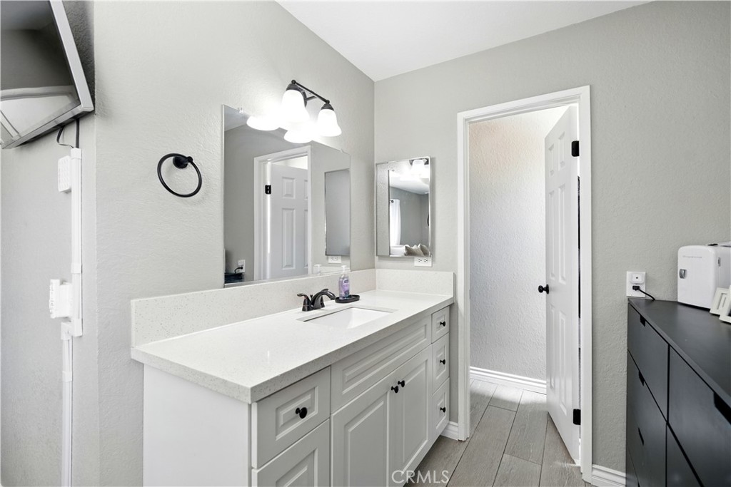 811 West James Street Rialto, CA 92376 - Photo 20 of 43 a bathroom with a sink vanity toilet and shower