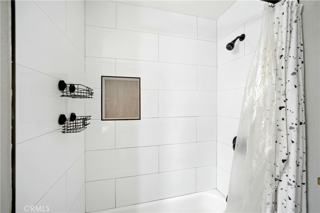 811 West James Street Rialto, CA 92376 - Photo 24 of 43 a bathroom with a shower