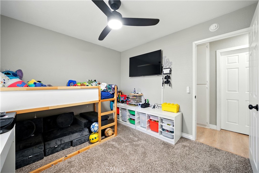 811 West James Street Rialto, CA 92376 - Photo 28 of 43 a children room with furniture and a flat screen tv