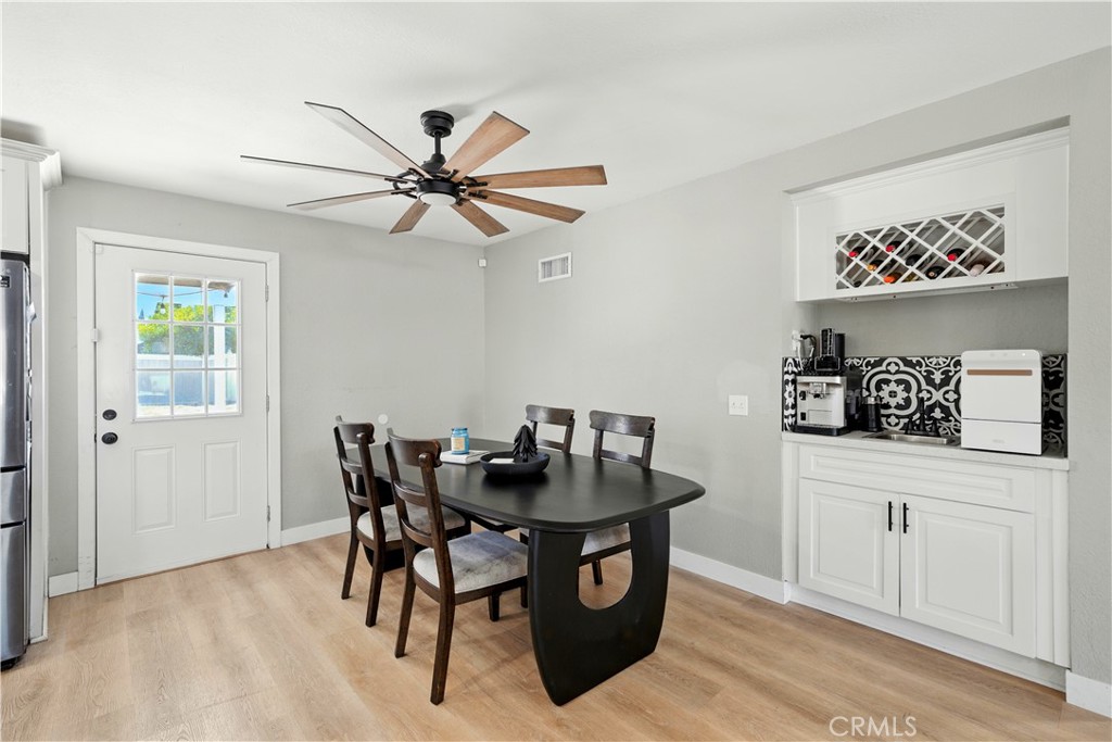 811 West James Street Rialto, CA 92376 - Photo 3 of 43 a view of a dining room with furniture and wooden floor