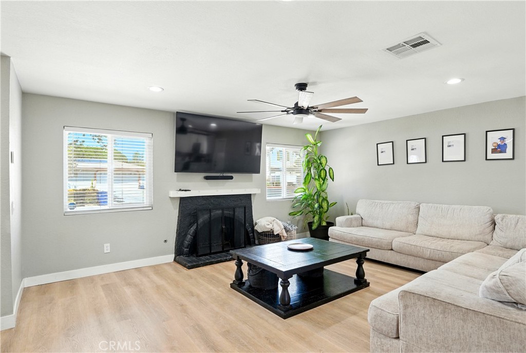 811 West James Street Rialto, CA 92376 - Photo 8 of 43 a living room with furniture and a fireplace