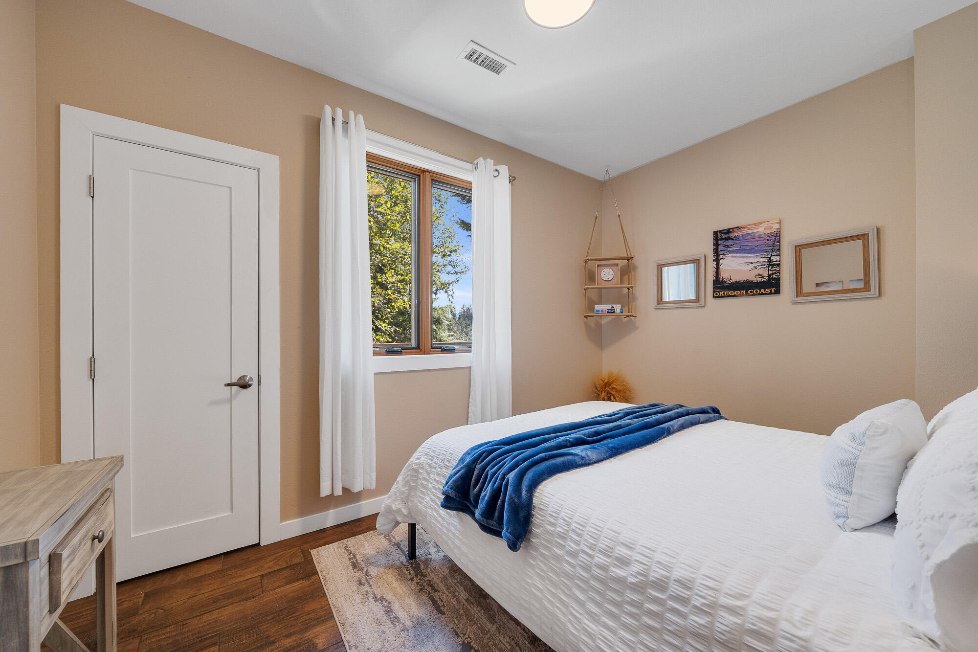 13150 D Street Nehalem, OR 97131 - Photo 21 of 29 a bedroom with a bed and a window