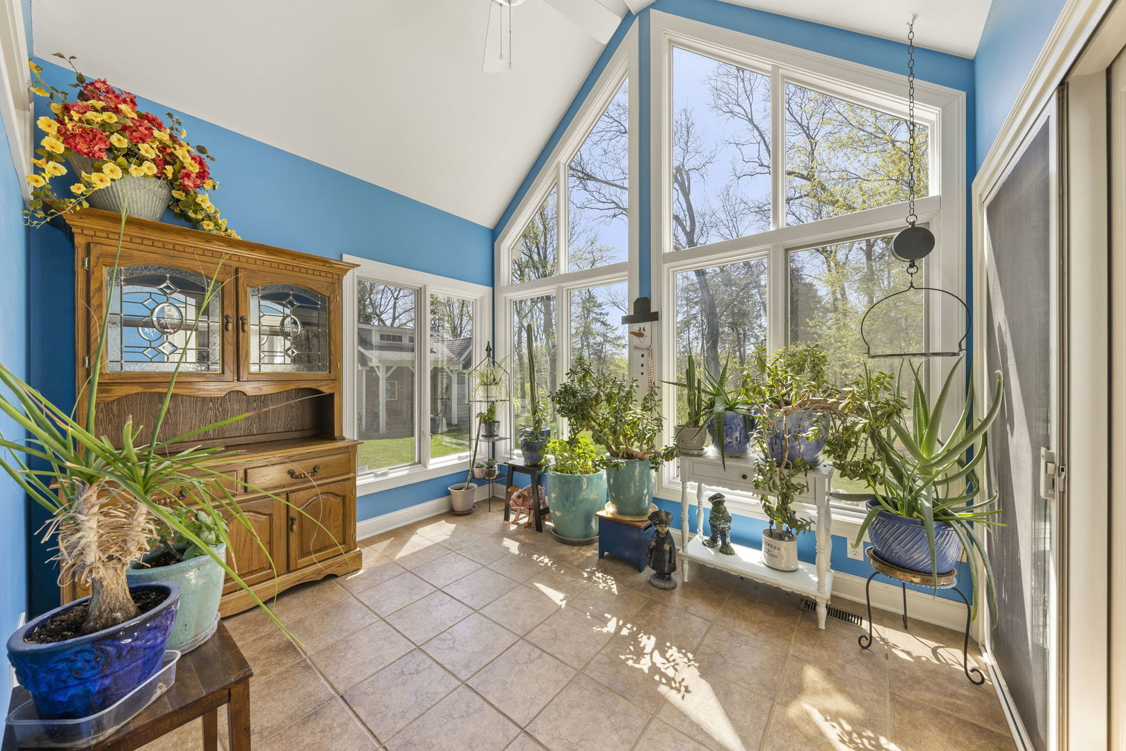 15646 Griswold Springs Road Plano, IL 60545 - Photo 12 of 46 a living room with furniture and a potted plant