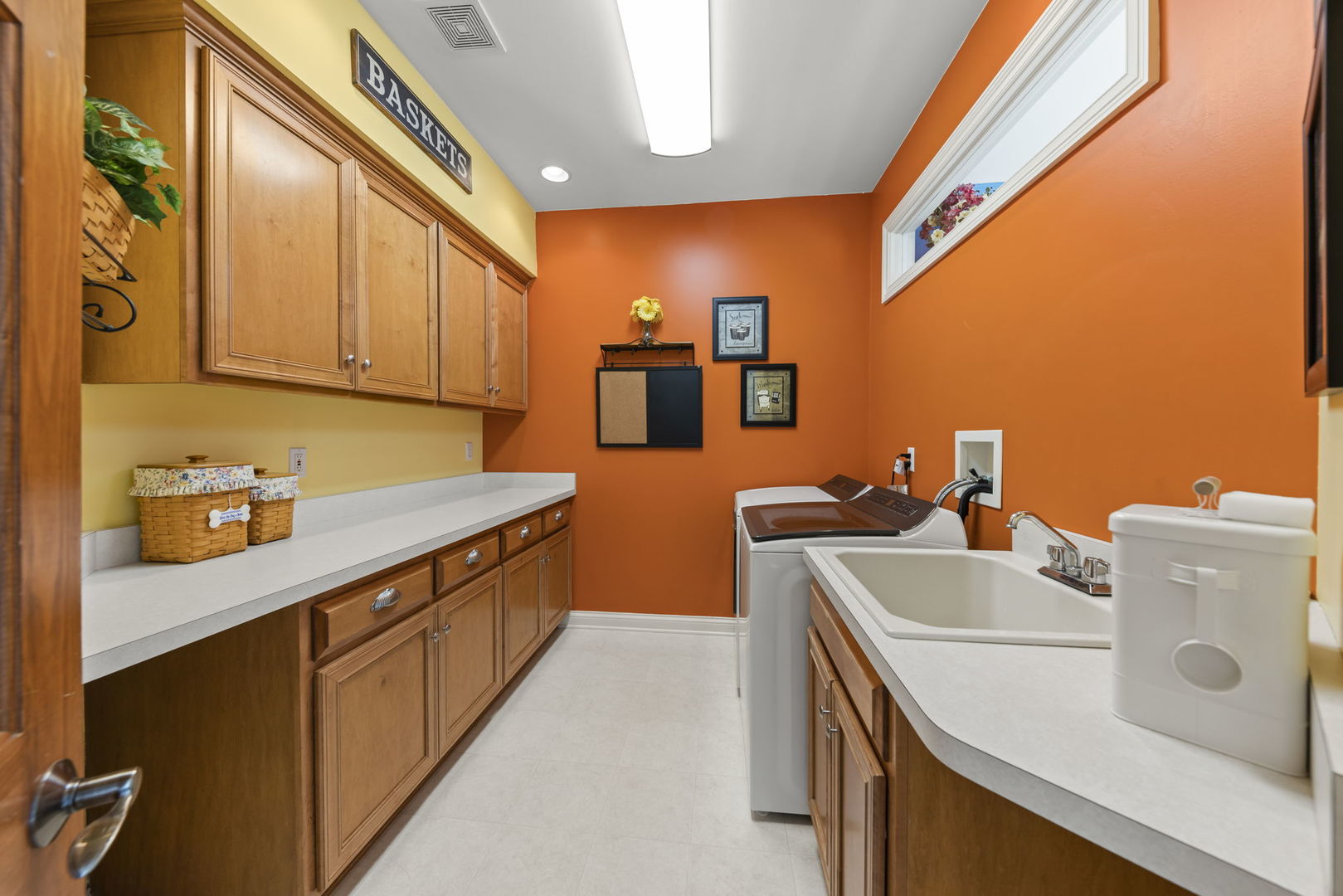 15646 Griswold Springs Road Plano, IL 60545 - Photo 16 of 46 a utility room with cabinets washer and dryer
