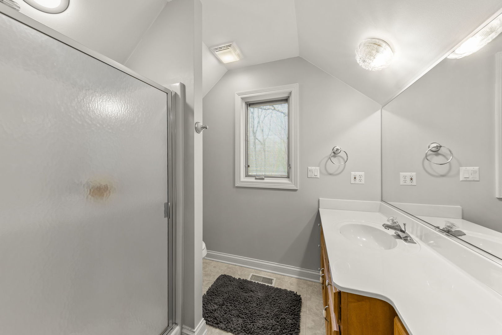 15646 Griswold Springs Road Plano, IL 60545 - Photo 19 of 46 a bathroom with a sink and a mirror