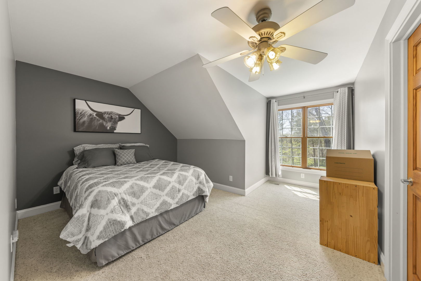 15646 Griswold Springs Road Plano, IL 60545 - Photo 20 of 46 a bedroom with a large bed chandelier and a window