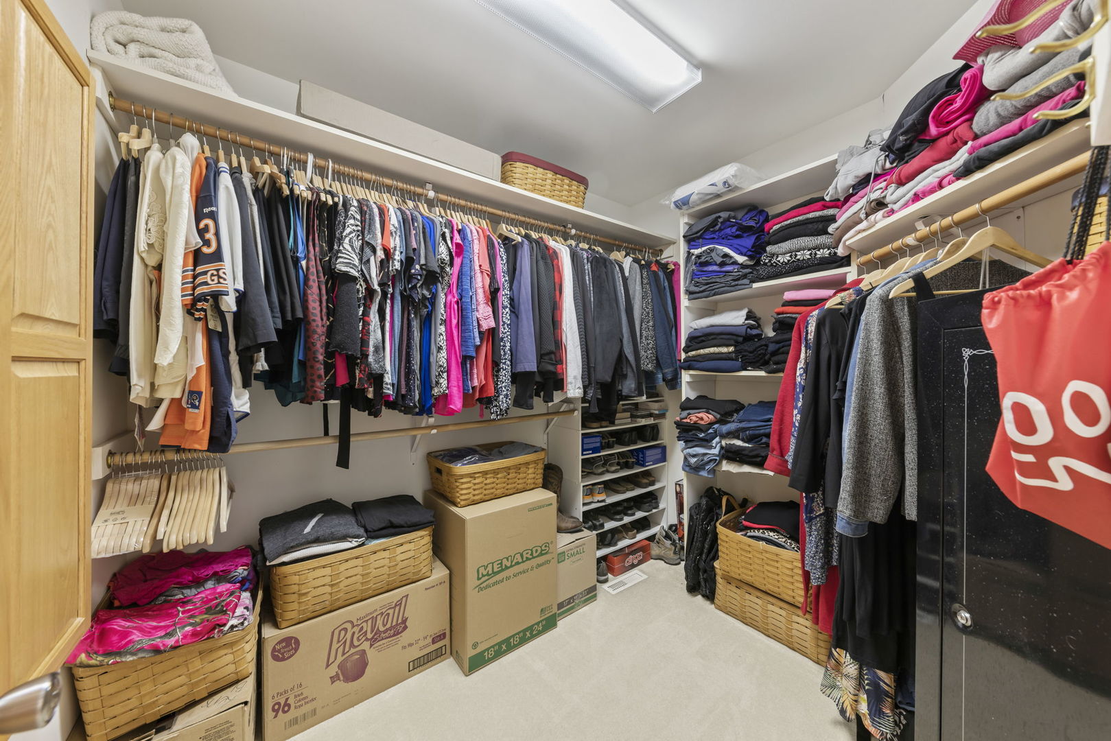 15646 Griswold Springs Road Plano, IL 60545 - Photo 24 of 46 a view of walk in closet with clothes and shoes