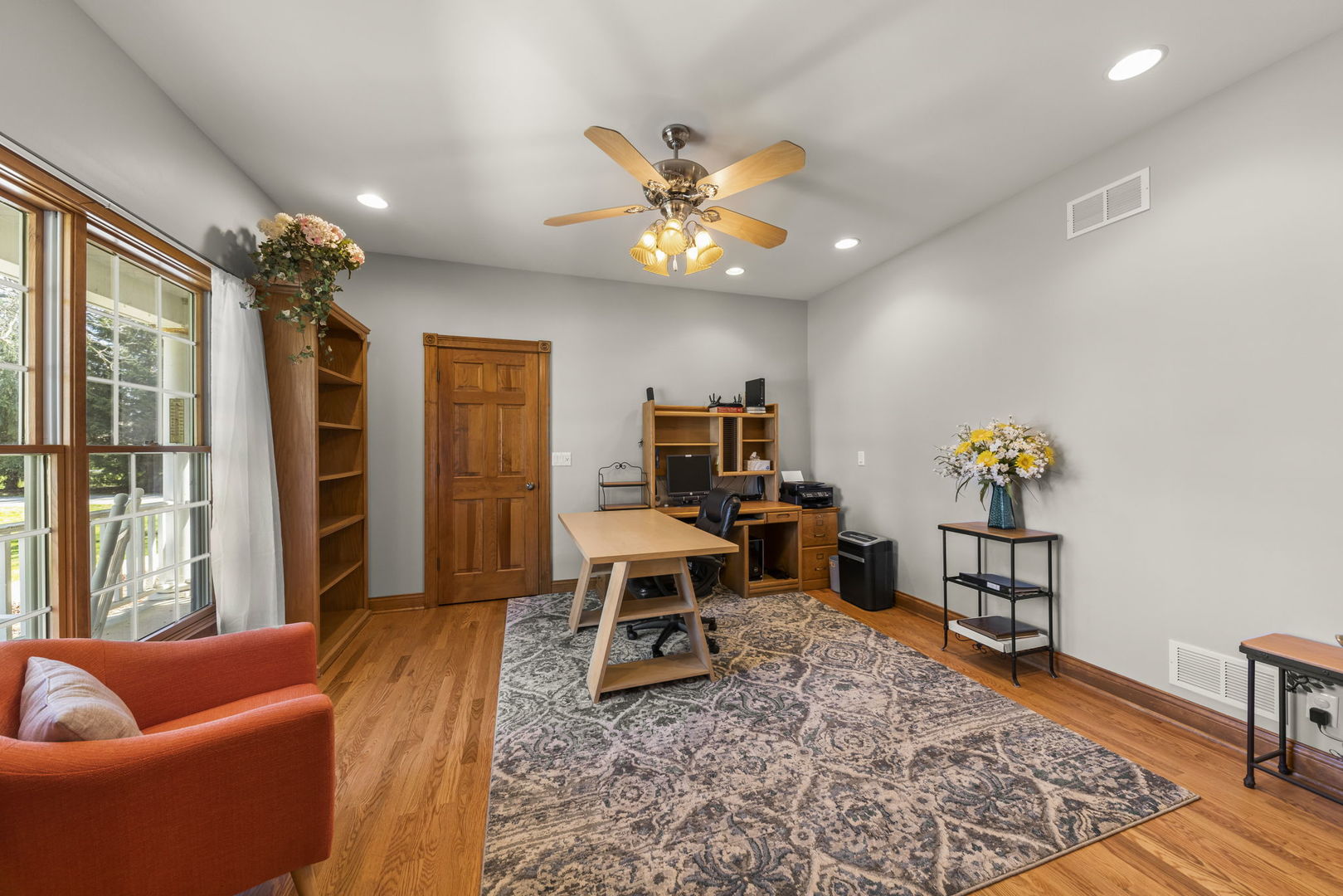 15646 Griswold Springs Road Plano, IL 60545 - Photo 4 of 46 a living room with furniture and wooden floor