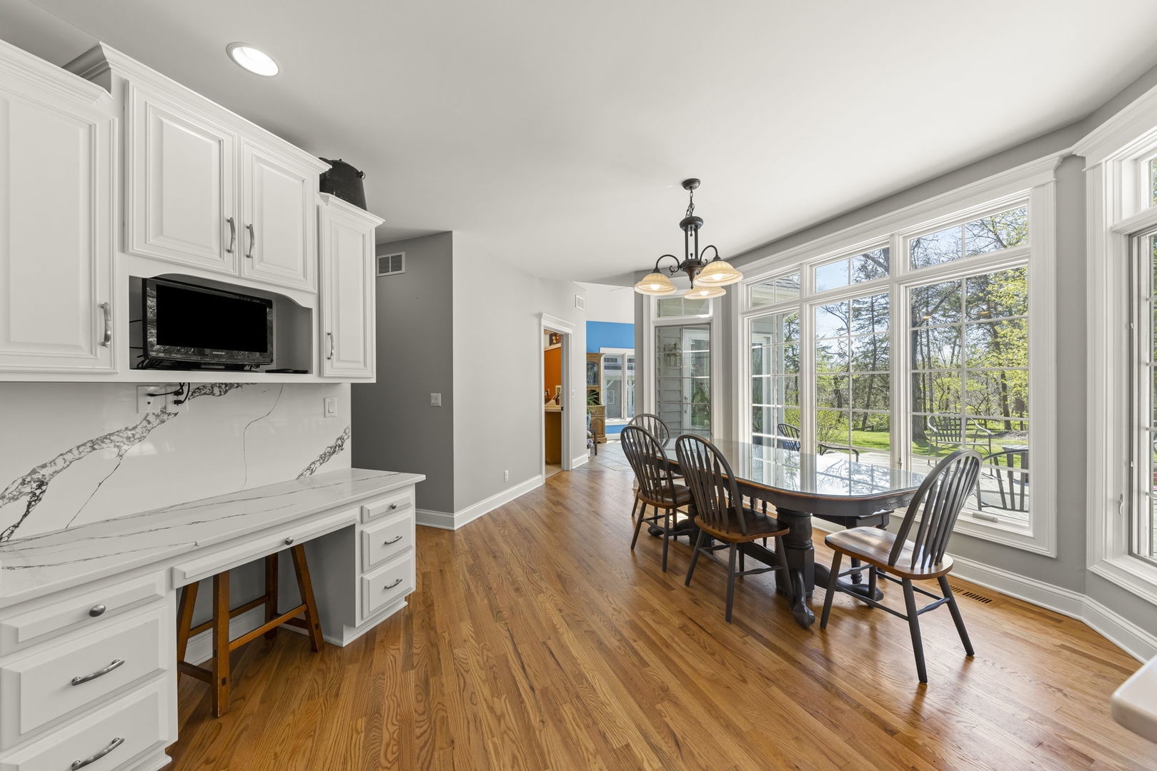15646 Griswold Springs Road Plano, IL 60545 - Photo 5 of 46 a view of a dining room with furniture window and wooden floor