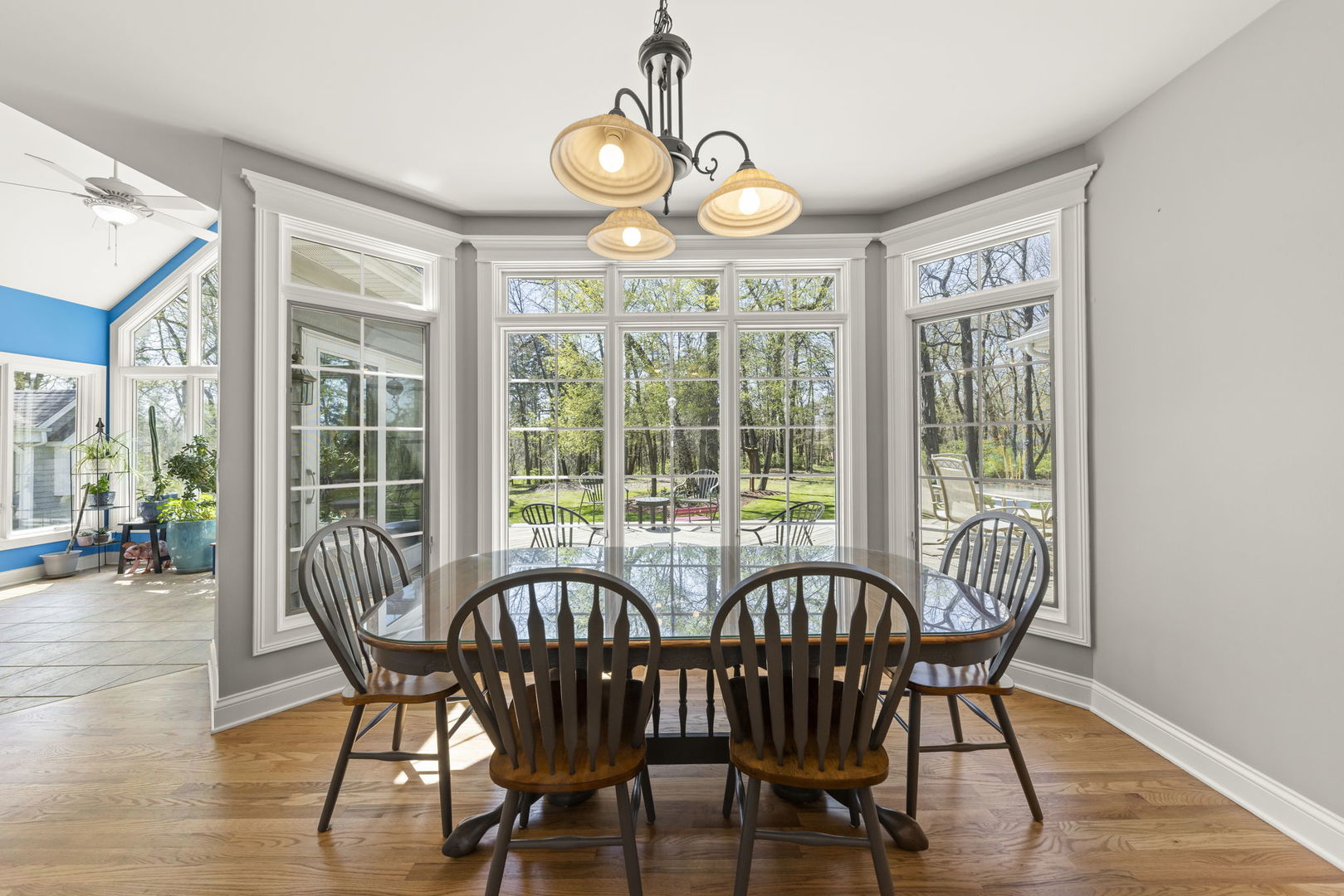 15646 Griswold Springs Road Plano, IL 60545 - Photo 9 of 46 a view of a dining room with furniture wooden floor and chandelier