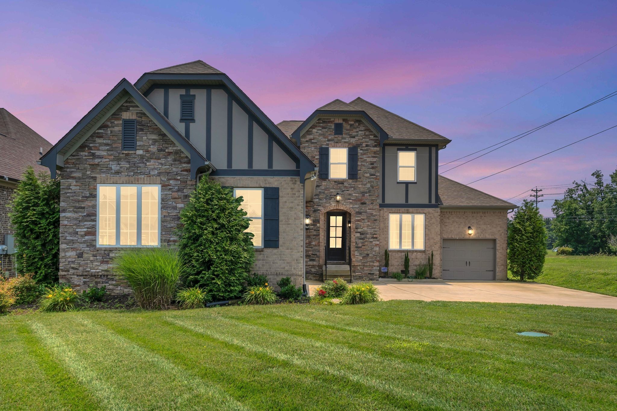 a front view of a house with a yard