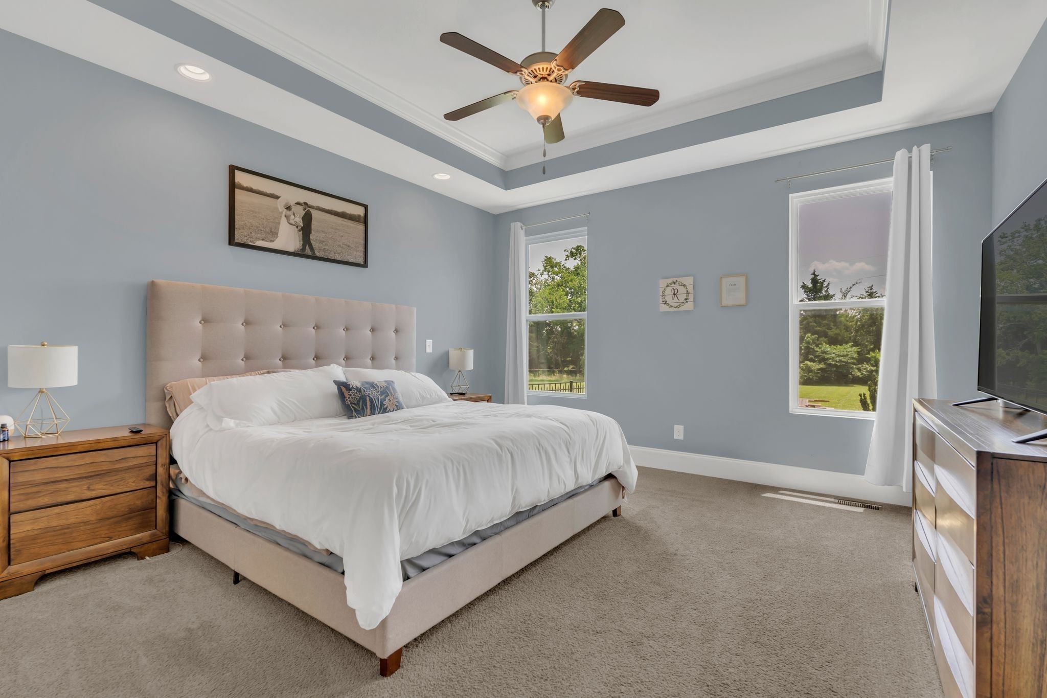 7121 Springwater Street Smyrna, TN 37167 - Photo 17 of 33 a spacious bedroom with a bed and a flat screen tv