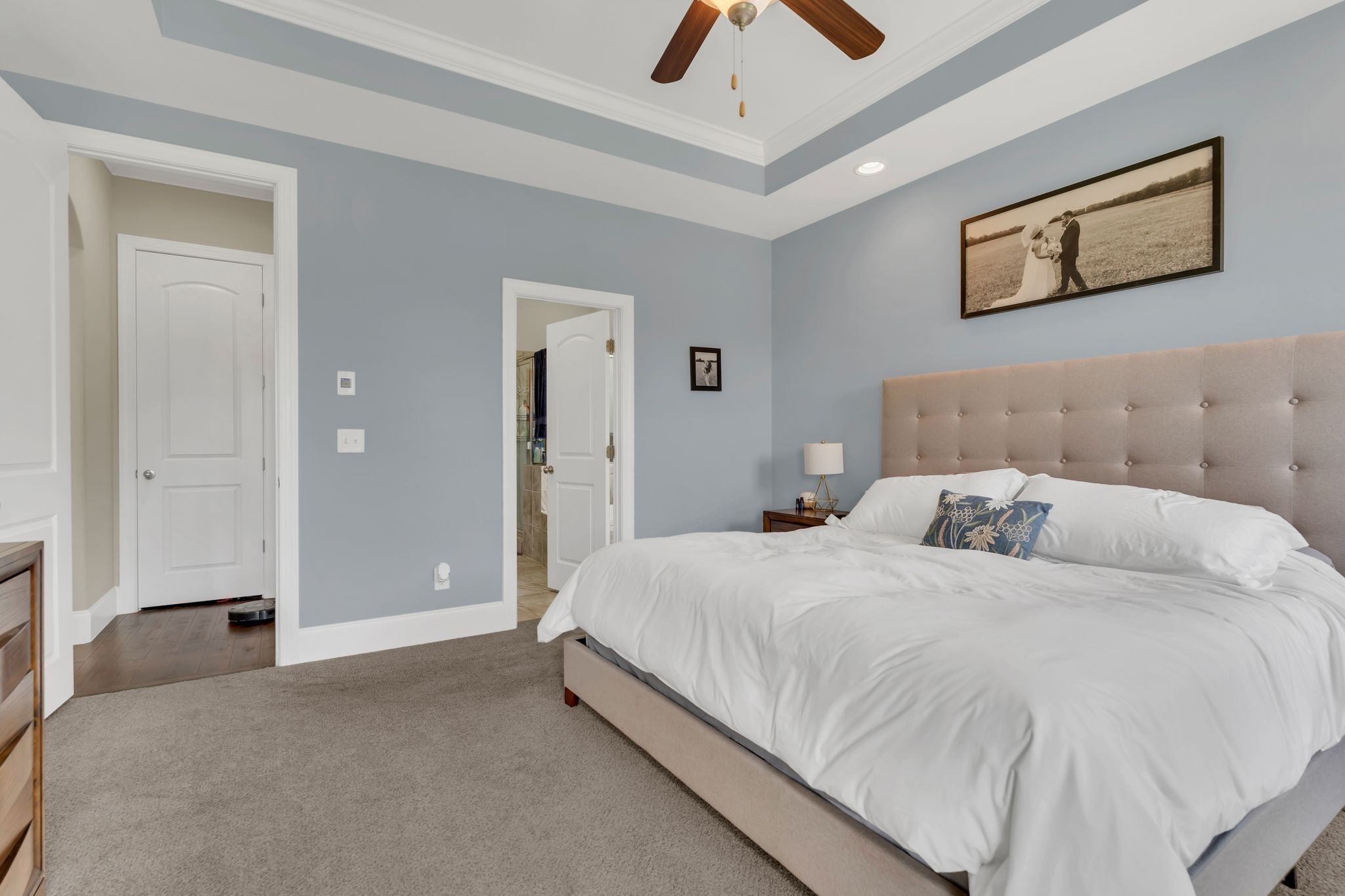 7121 Springwater Street Smyrna, TN 37167 - Photo 18 of 33 a bedroom with a bed and painting on the wall