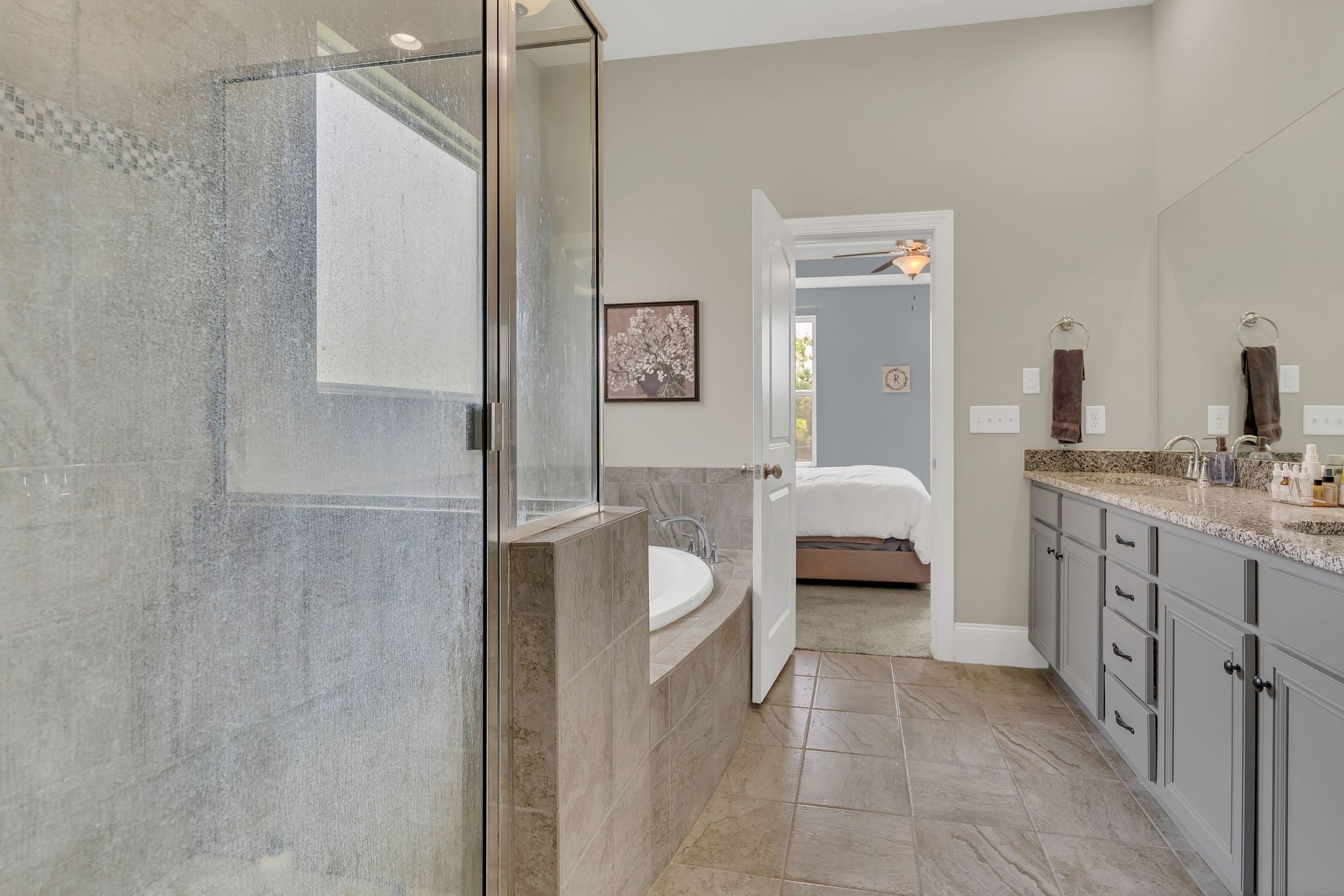 7121 Springwater Street Smyrna, TN 37167 - Photo 20 of 33 a en suite bathroom with a double vanity sink a mirror and a shower