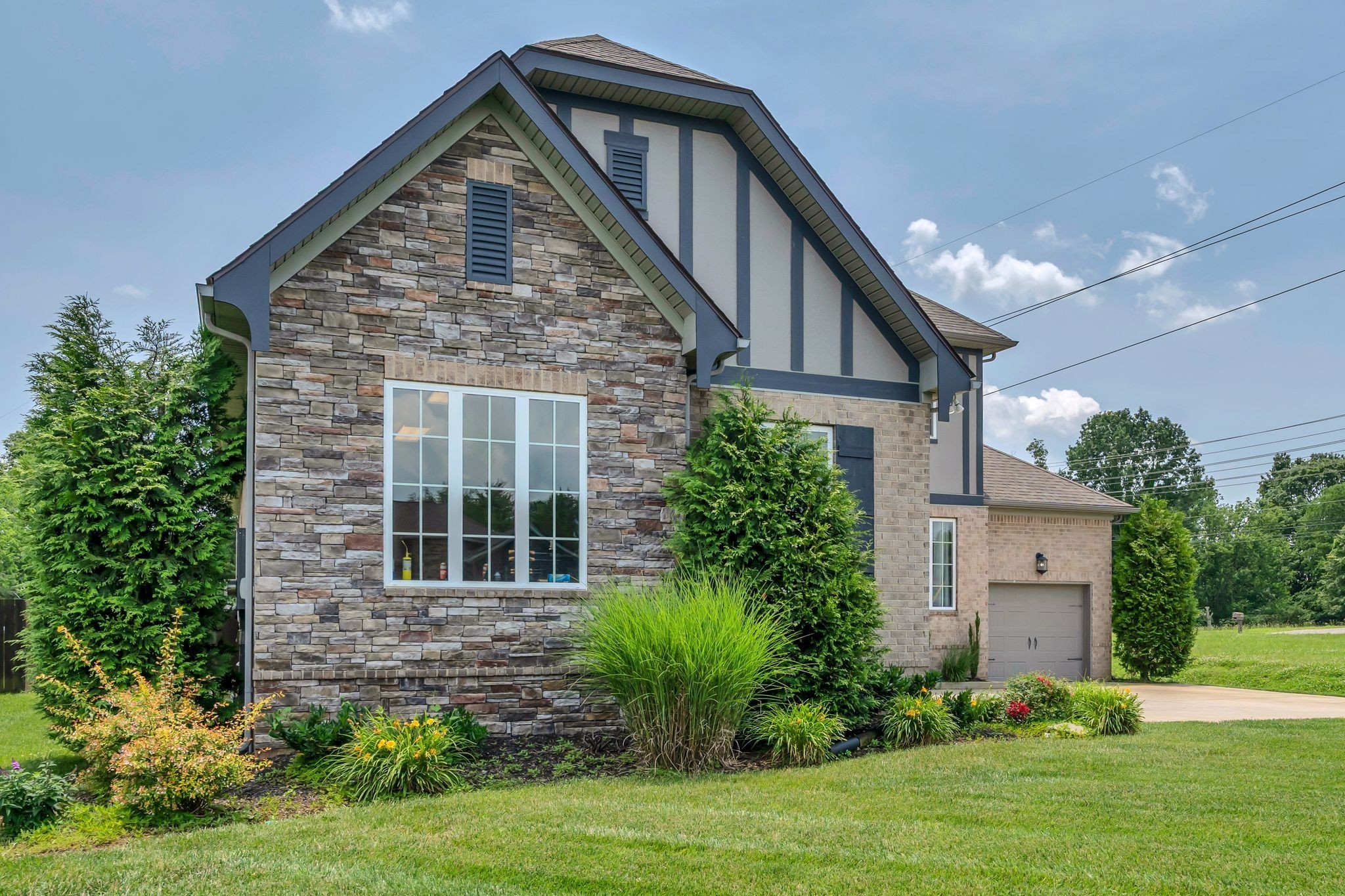 7121 Springwater Street Smyrna, TN 37167 - Photo 2 of 33 a front view of a house with garden
