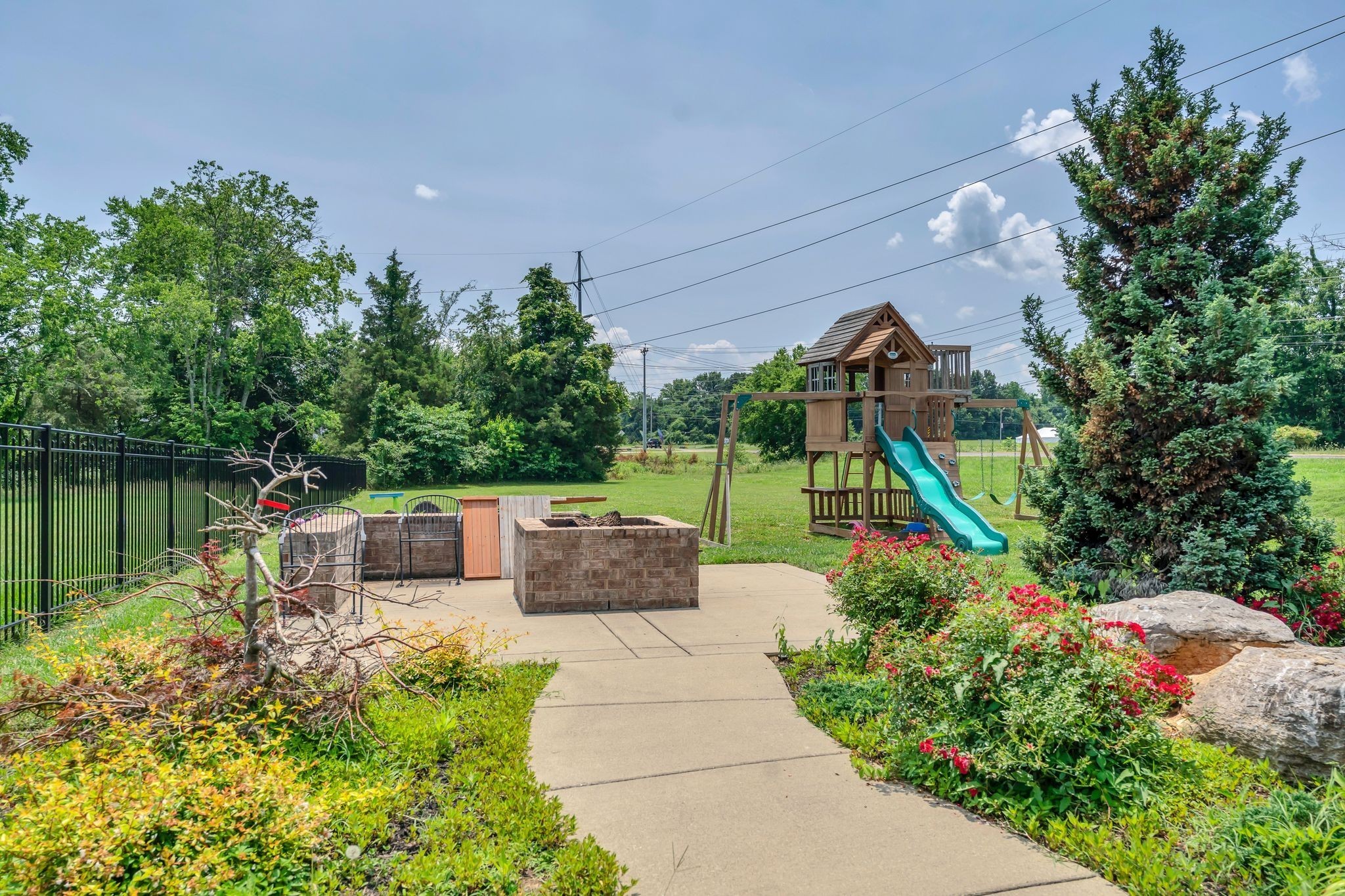 7121 Springwater Street Smyrna, TN 37167 - Photo 27 of 33 a view of a garden with plants and a lake view