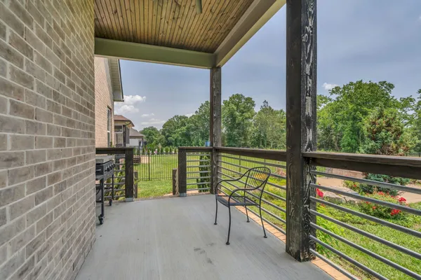 a view of a porch with a bench