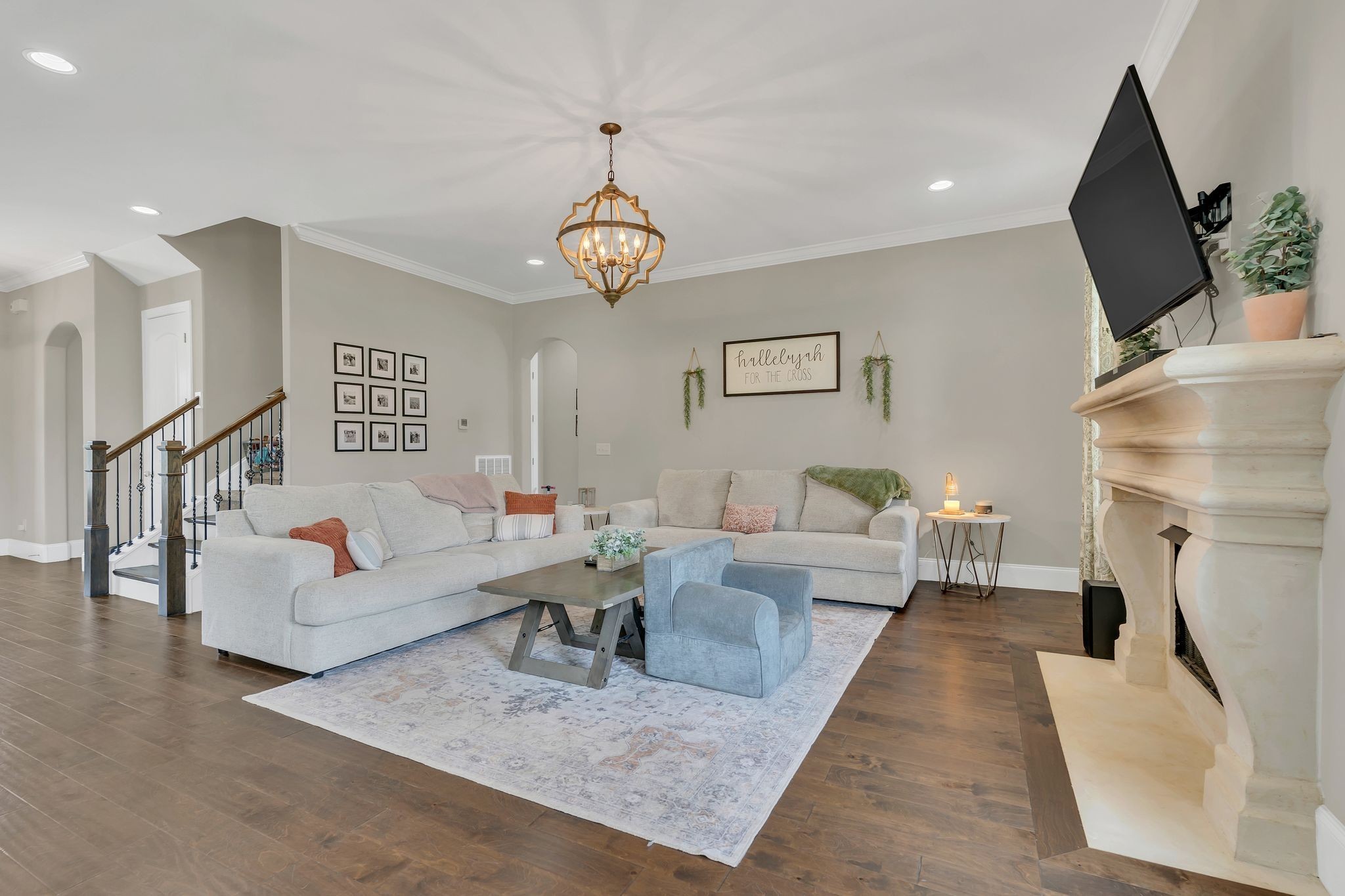 7121 Springwater Street Smyrna, TN 37167 - Photo 5 of 33 a living room with furniture wooden floor and a fireplace