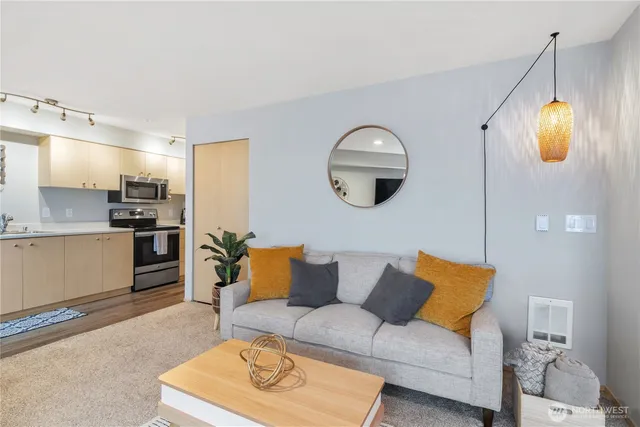 a living room with furniture and a large window