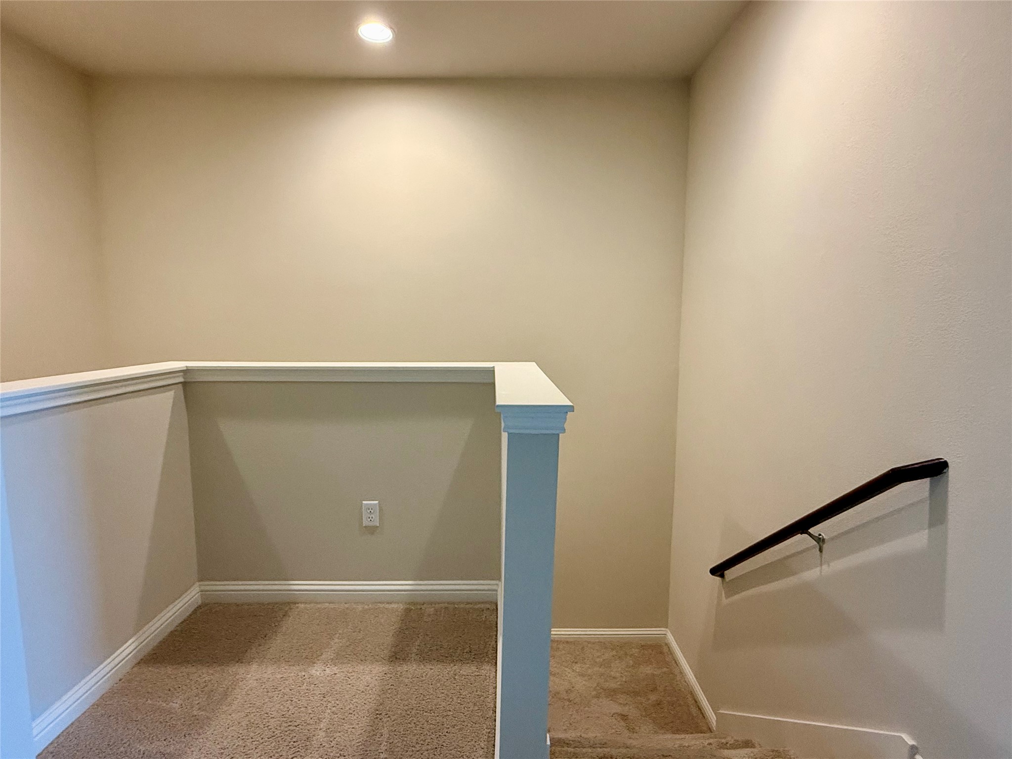 6814 East Riverside Drive, Unit 73 Austin, TX 78741 - Photo 14 of 33 Upper-level landing featuring neutral carpeting, white baseboards, and a recessed ceiling light
