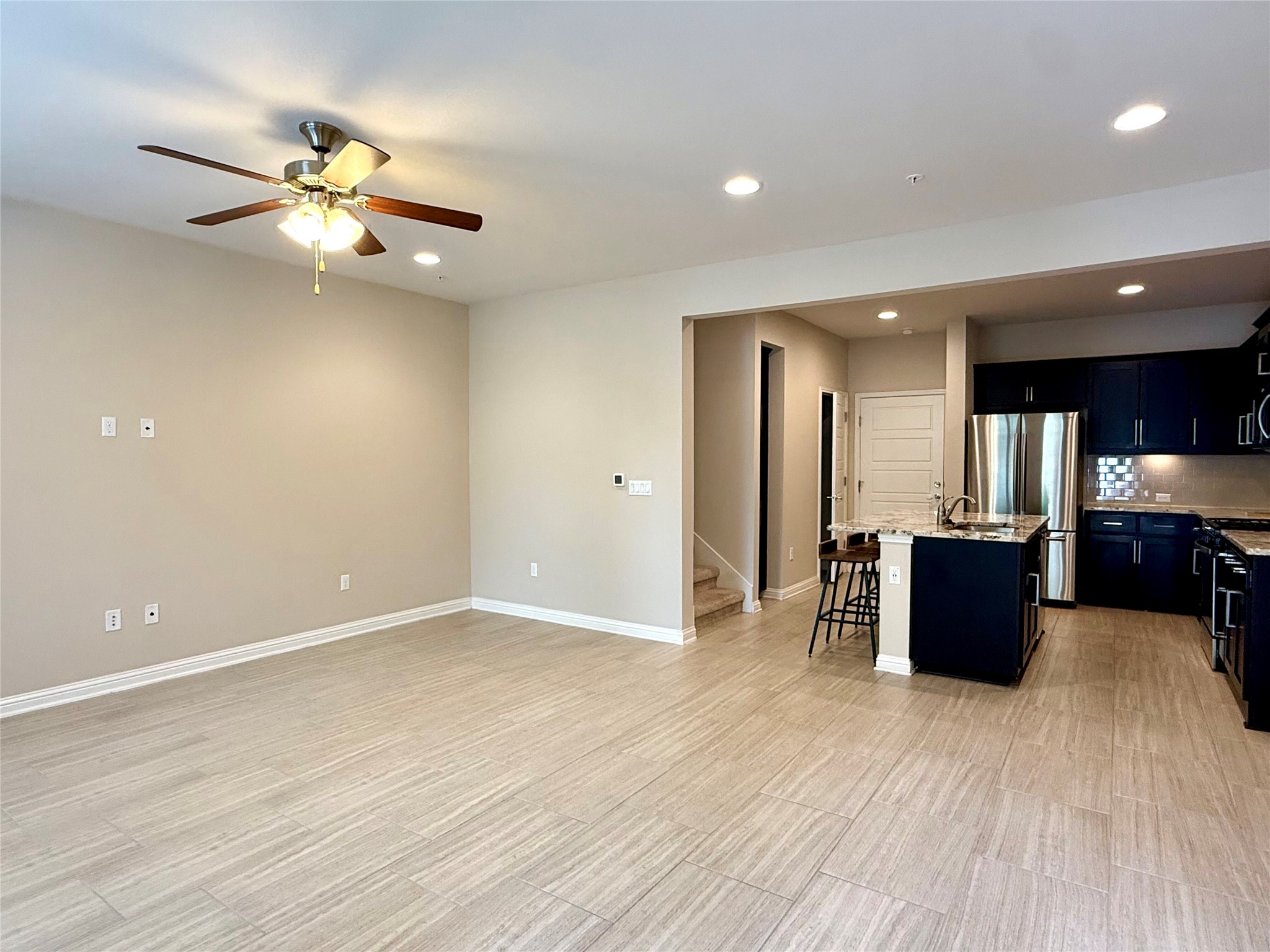 6814 East Riverside Drive, Unit 73 Austin, TX 78741 - Photo 8 of 33 Open-concept living area featuring wood-finish flooring, recessed lighting, and a ceiling fan