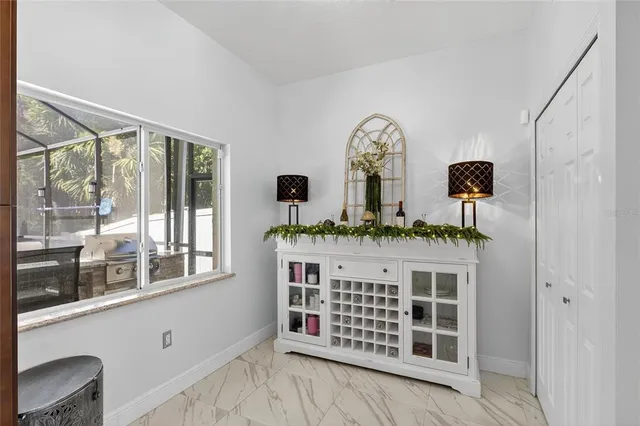 a view of an entryway with wooden floor