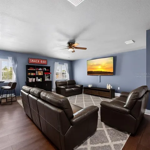 an aerial view of a house with a yard basket ball court