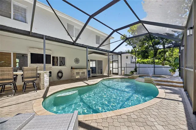 an aerial view of a house with a garden