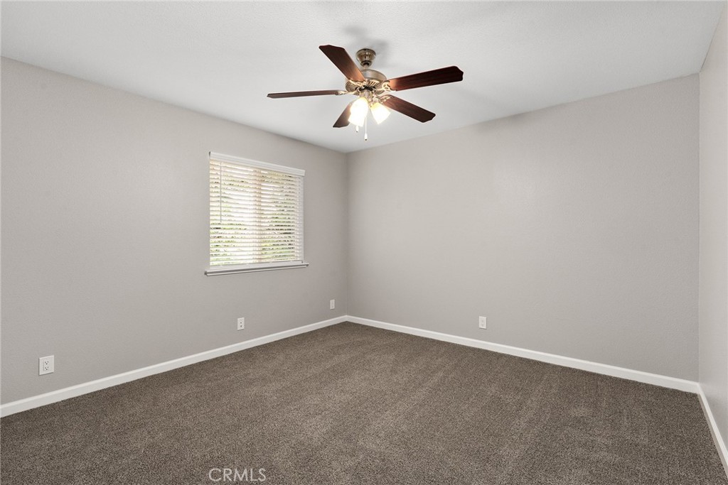2159 Elm Street, Unit 2 Chico, CA 95928 - Photo 18 of 28 an empty room with a window and a fan