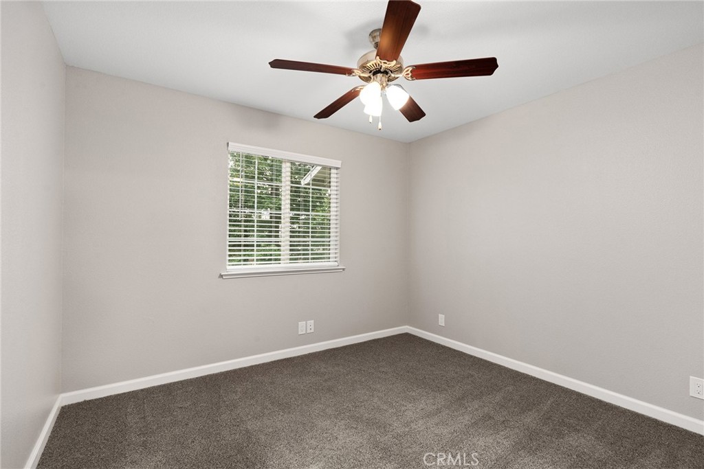 2159 Elm Street, Unit 2 Chico, CA 95928 - Photo 22 of 28 an empty room with a window and a fan