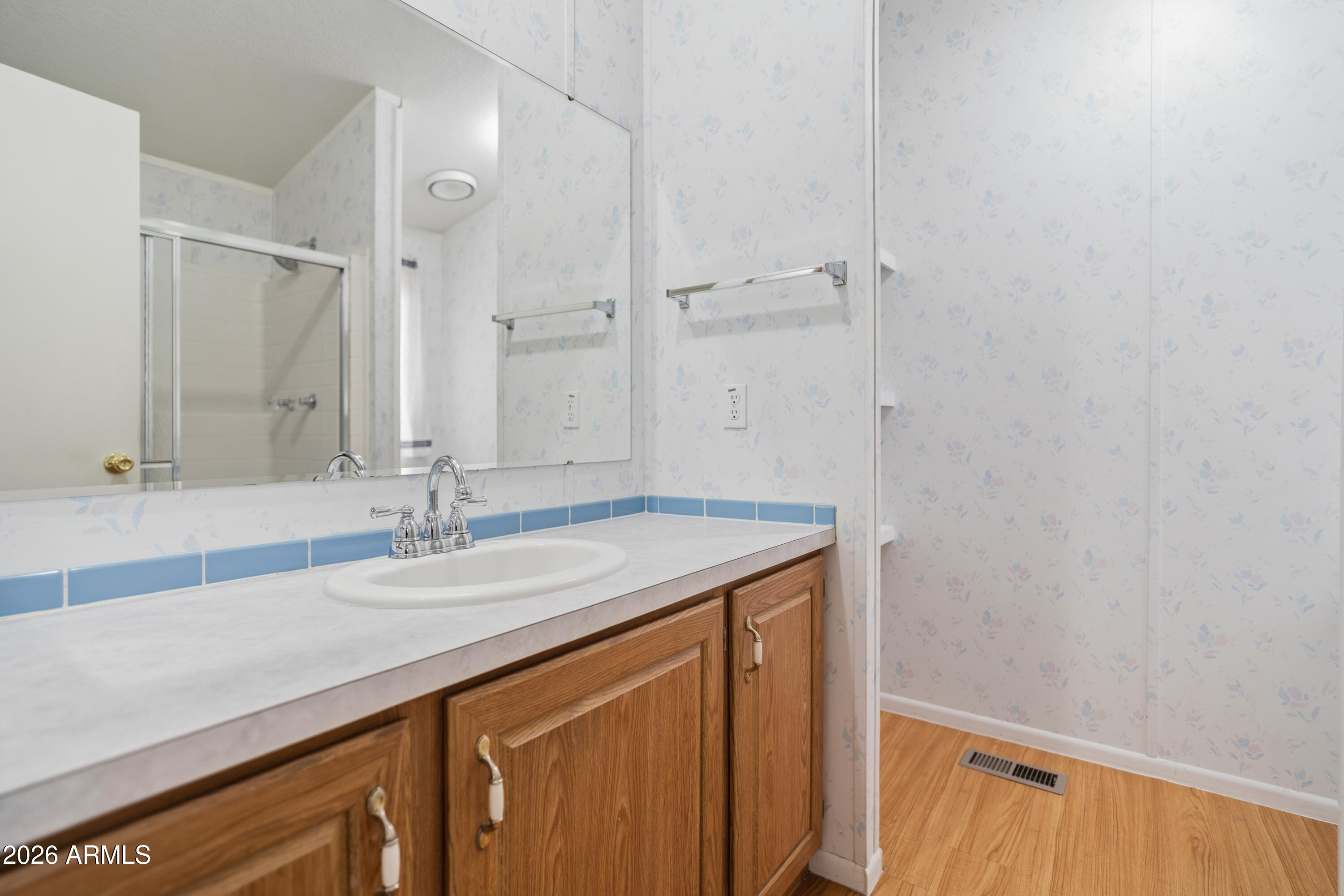 1106 West Crestview Drive Payson, AZ 85541 - Photo 10 of 24 a bathroom with a granite countertop sink and a mirror