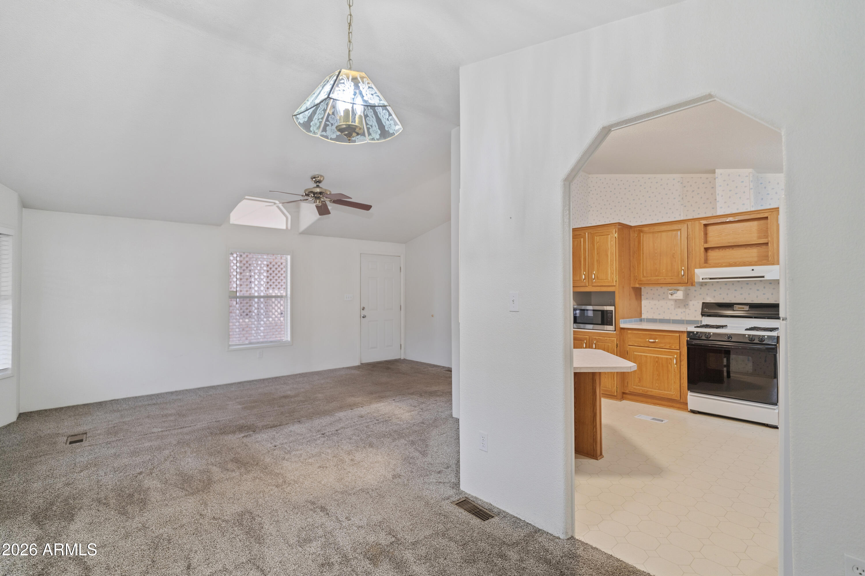 1106 West Crestview Drive Payson, AZ 85541 - Photo 13 of 24 an empty room with a kitchen