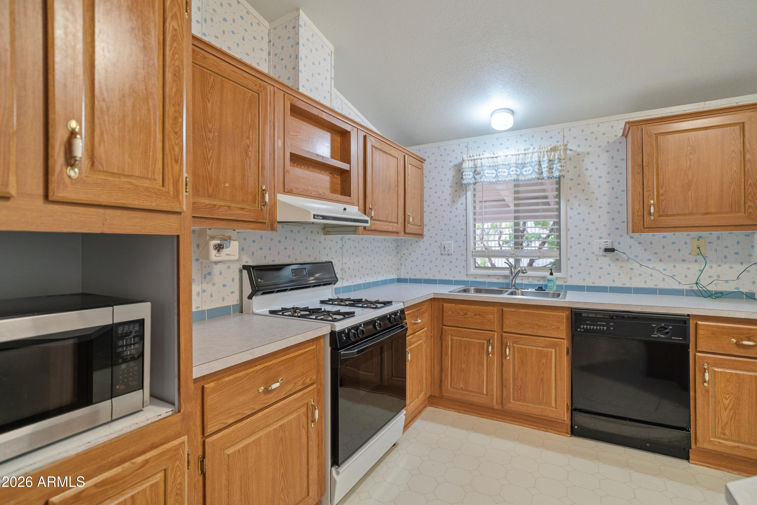 1106 West Crestview Drive Payson, AZ 85541 - Photo 16 of 24 a kitchen with stainless steel appliances granite countertop a stove and a sink