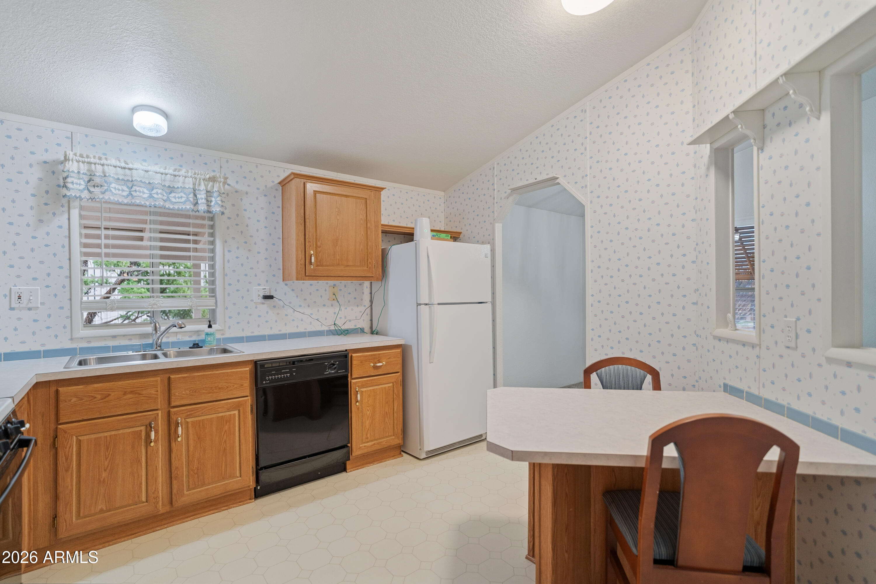 1106 West Crestview Drive Payson, AZ 85541 - Photo 17 of 24 a kitchen with stainless steel appliances a stove a sink and a refrigerator