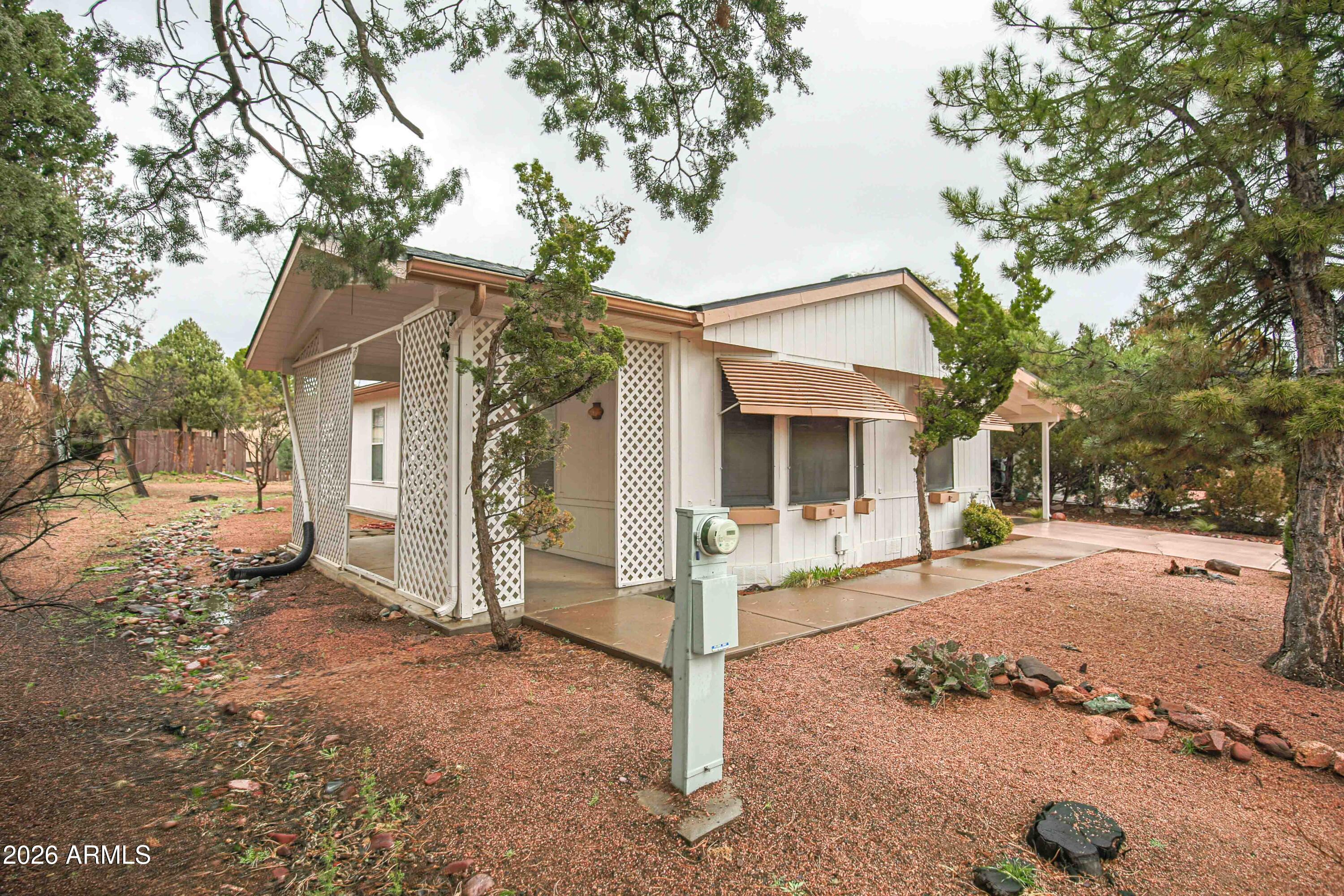 1106 West Crestview Drive Payson, AZ 85541 - Photo 20 of 24 a front view of a house with a tree