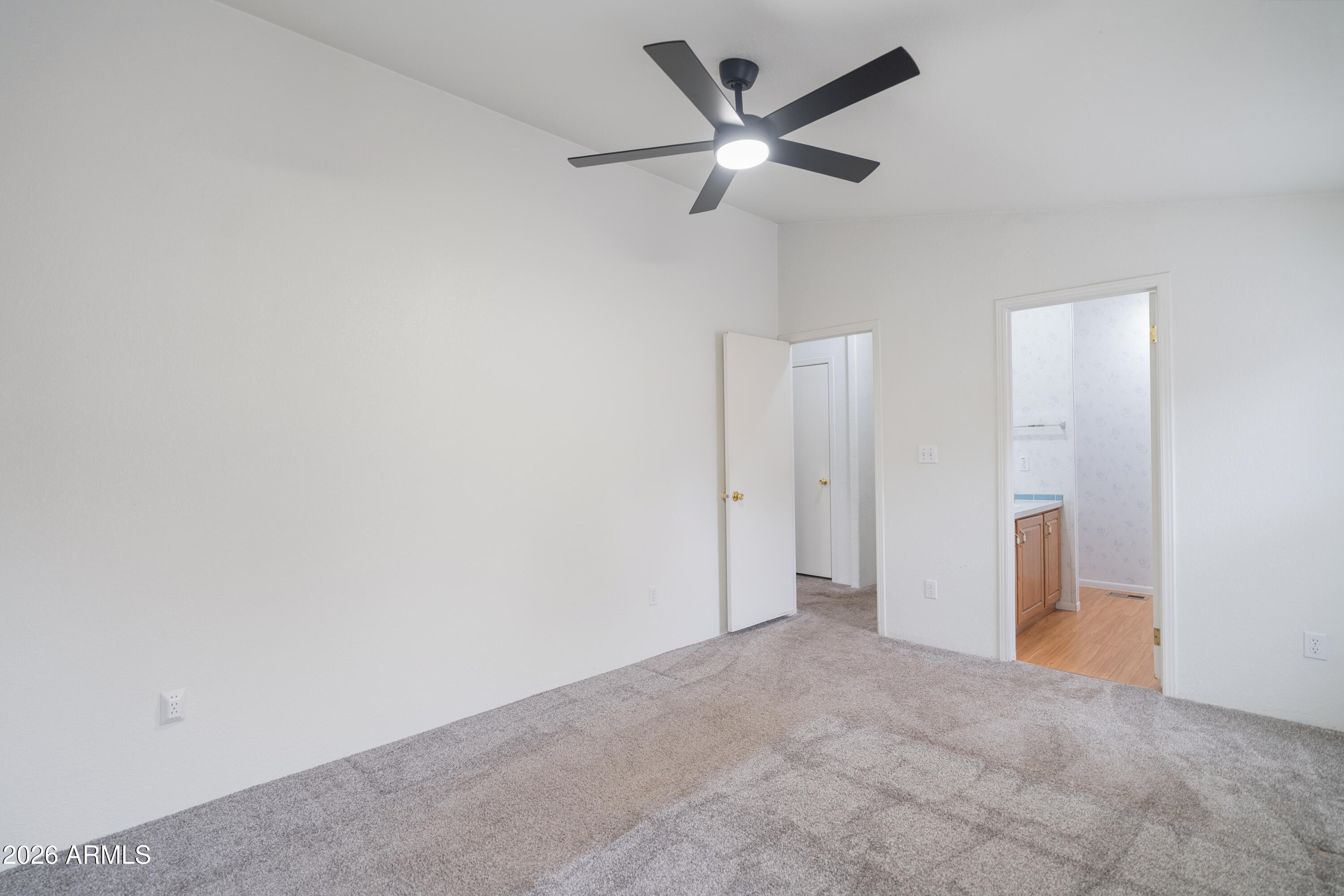 1106 West Crestview Drive Payson, AZ 85541 - Photo 4 of 24 an empty room with a ceiling fan and a window
