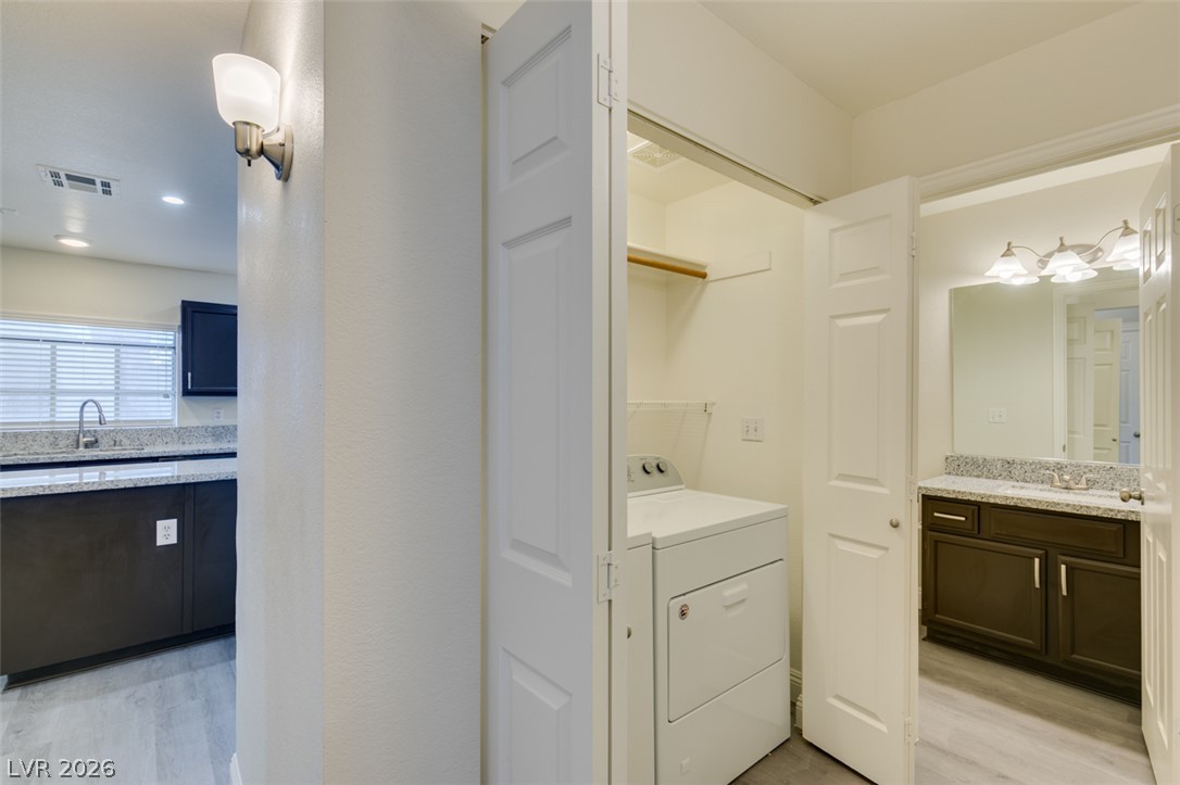 1738 Toltec Circle Henderson, NV 89014 - Photo 26 of 46 Functional laundry closet provides convenient access to a modern washer and dryer.