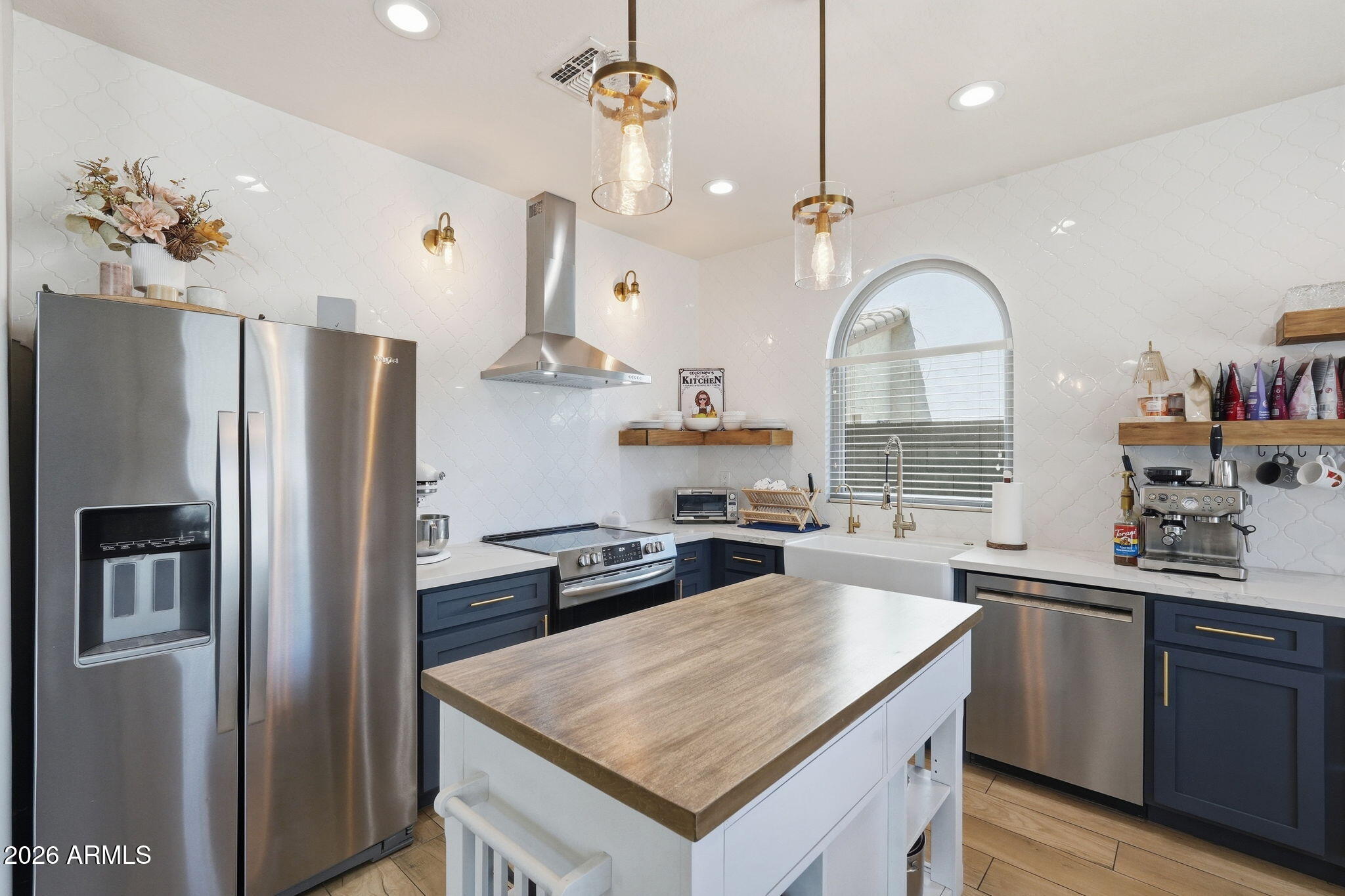 4184 East Trigger Way Gilbert, AZ 85297 - Photo 4 of 51 a kitchen with a refrigerator a sink and a refrigerator