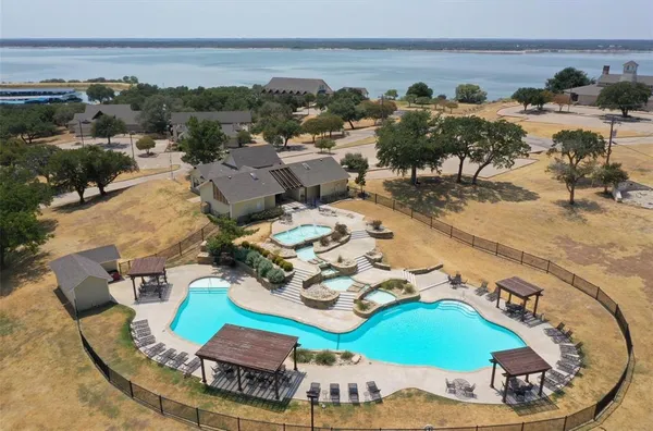 a view of a swimming pool with lounge chairs