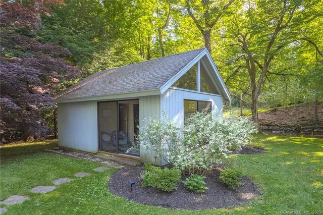 a view of swimming pool with a garden and trees