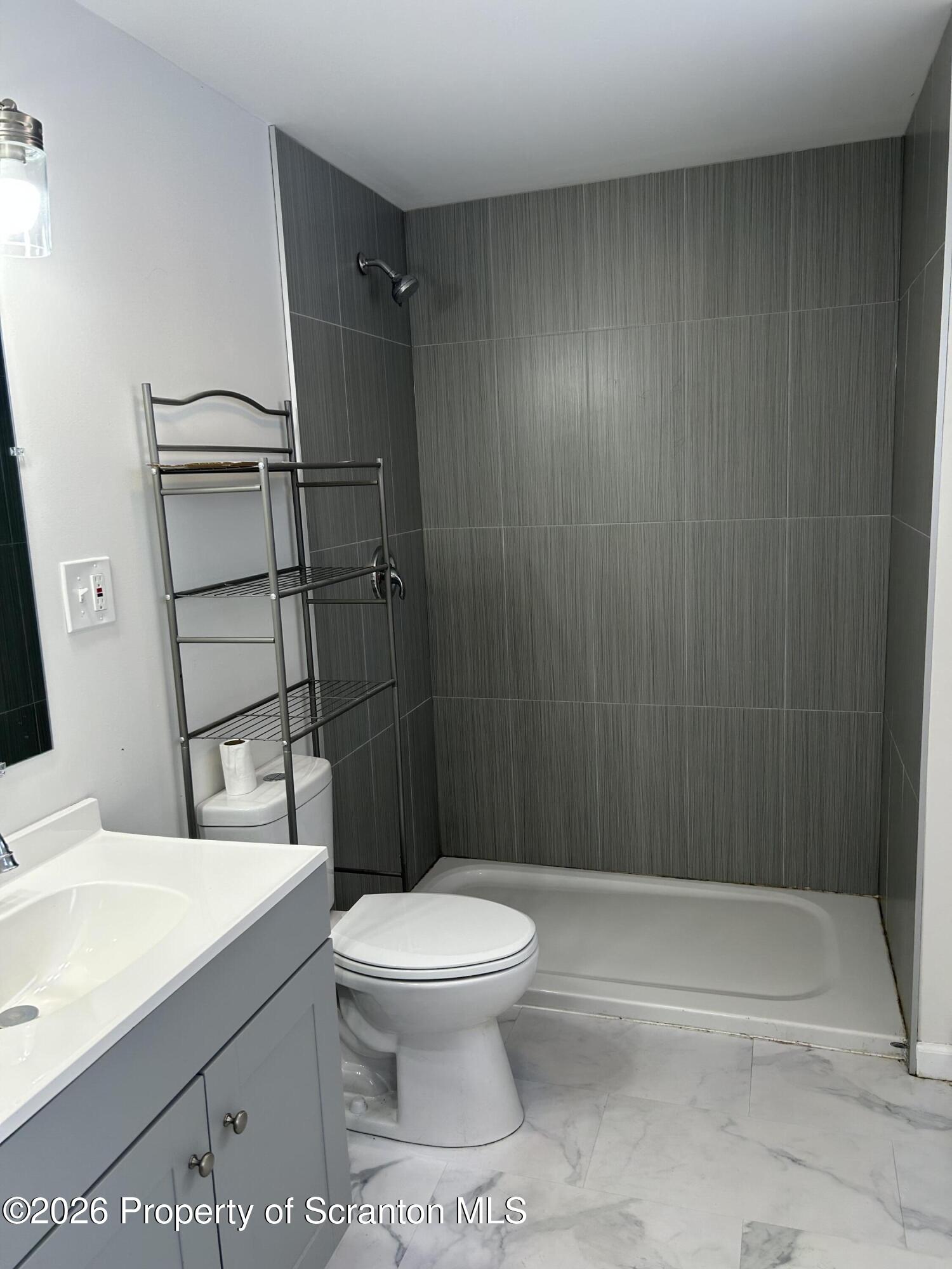 337 Wayne Street Archbald, PA 18403 - Photo 15 of 26 a bathroom with a toilet and a shower