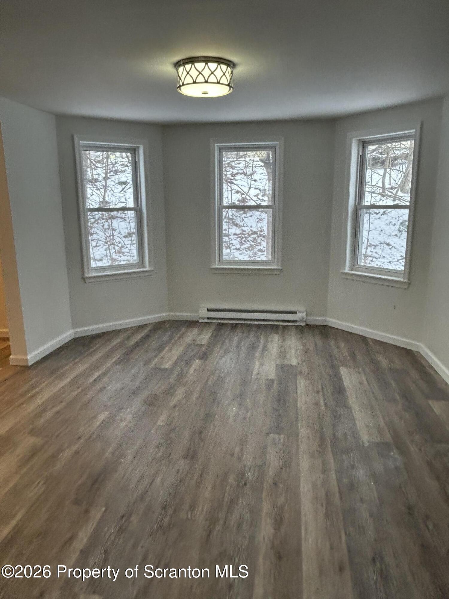 337 Wayne Street Archbald, PA 18403 - Photo 18 of 26 a view of an empty room and window