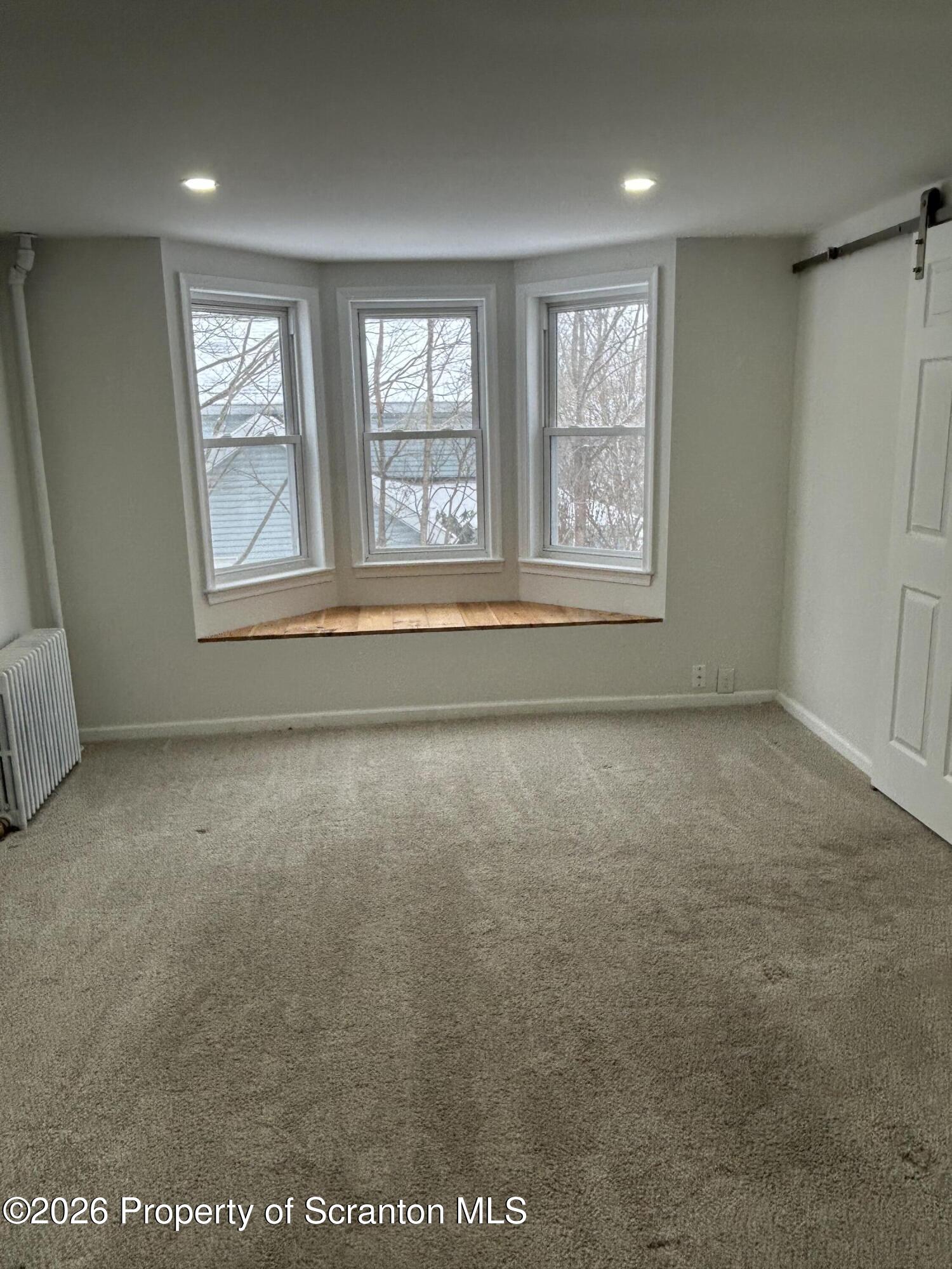337 Wayne Street Archbald, PA 18403 - Photo 20 of 26 an empty room with windows