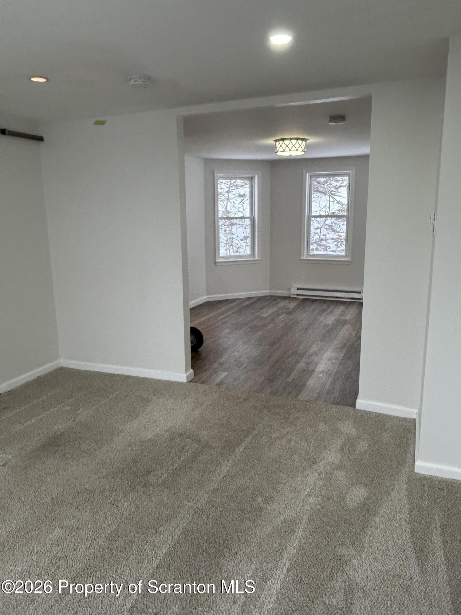 337 Wayne Street Archbald, PA 18403 - Photo 21 of 26 an empty room with windows