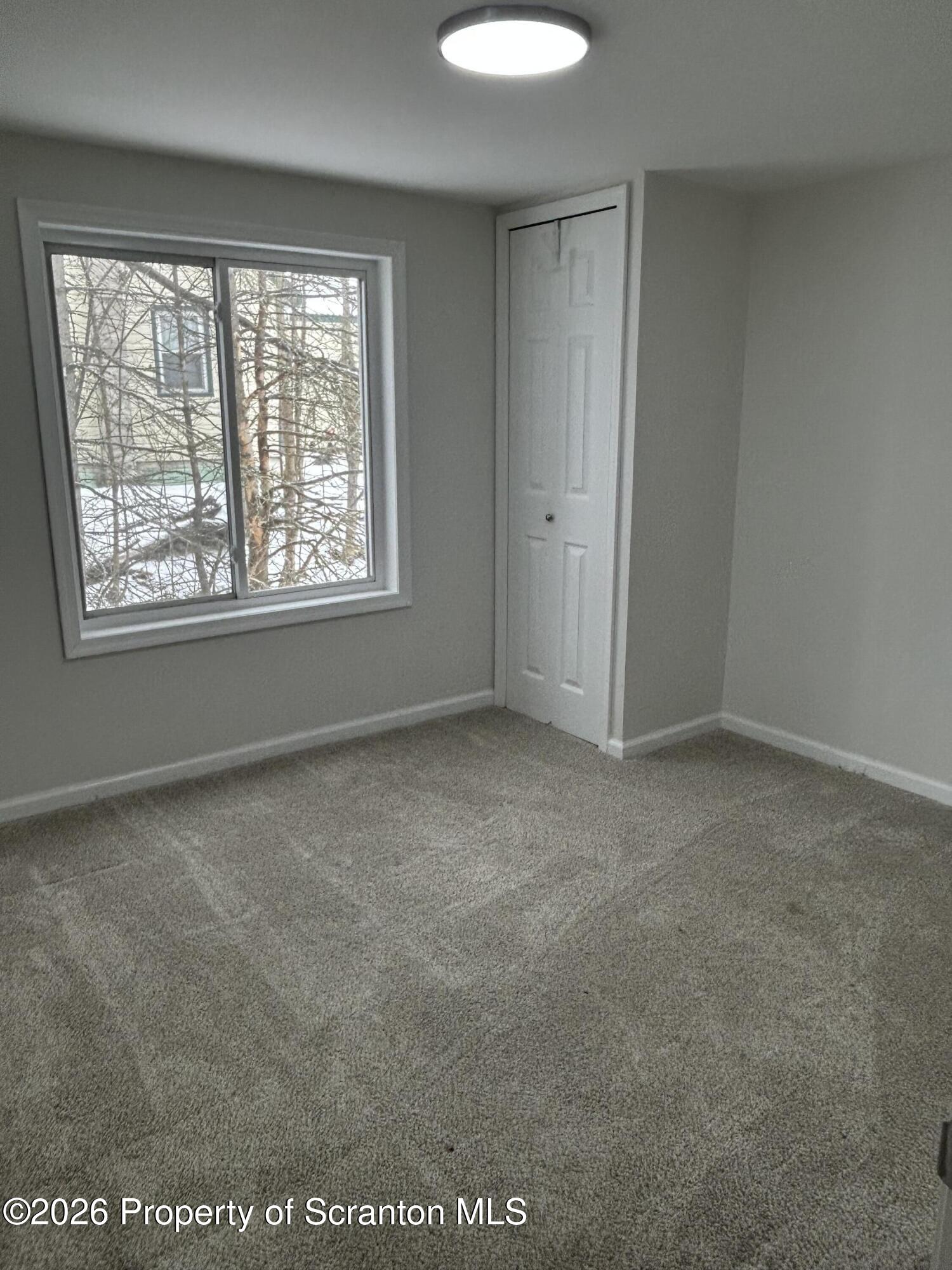 337 Wayne Street Archbald, PA 18403 - Photo 25 of 26 an empty room with a window