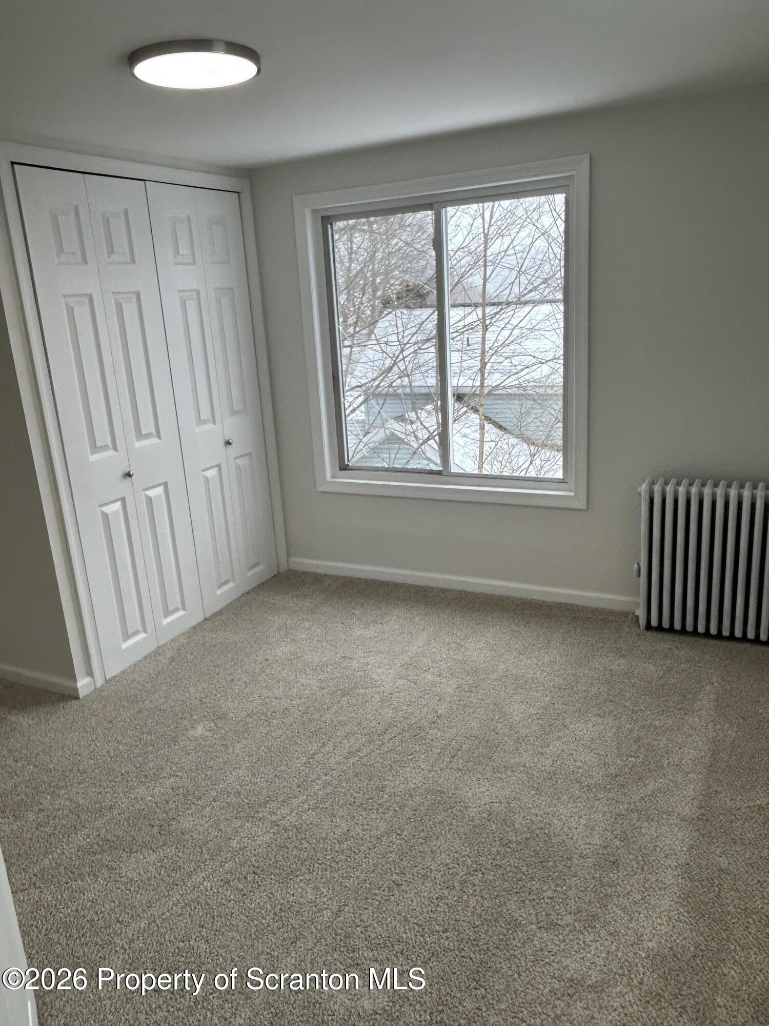 337 Wayne Street Archbald, PA 18403 - Photo 26 of 26 an empty room with windows