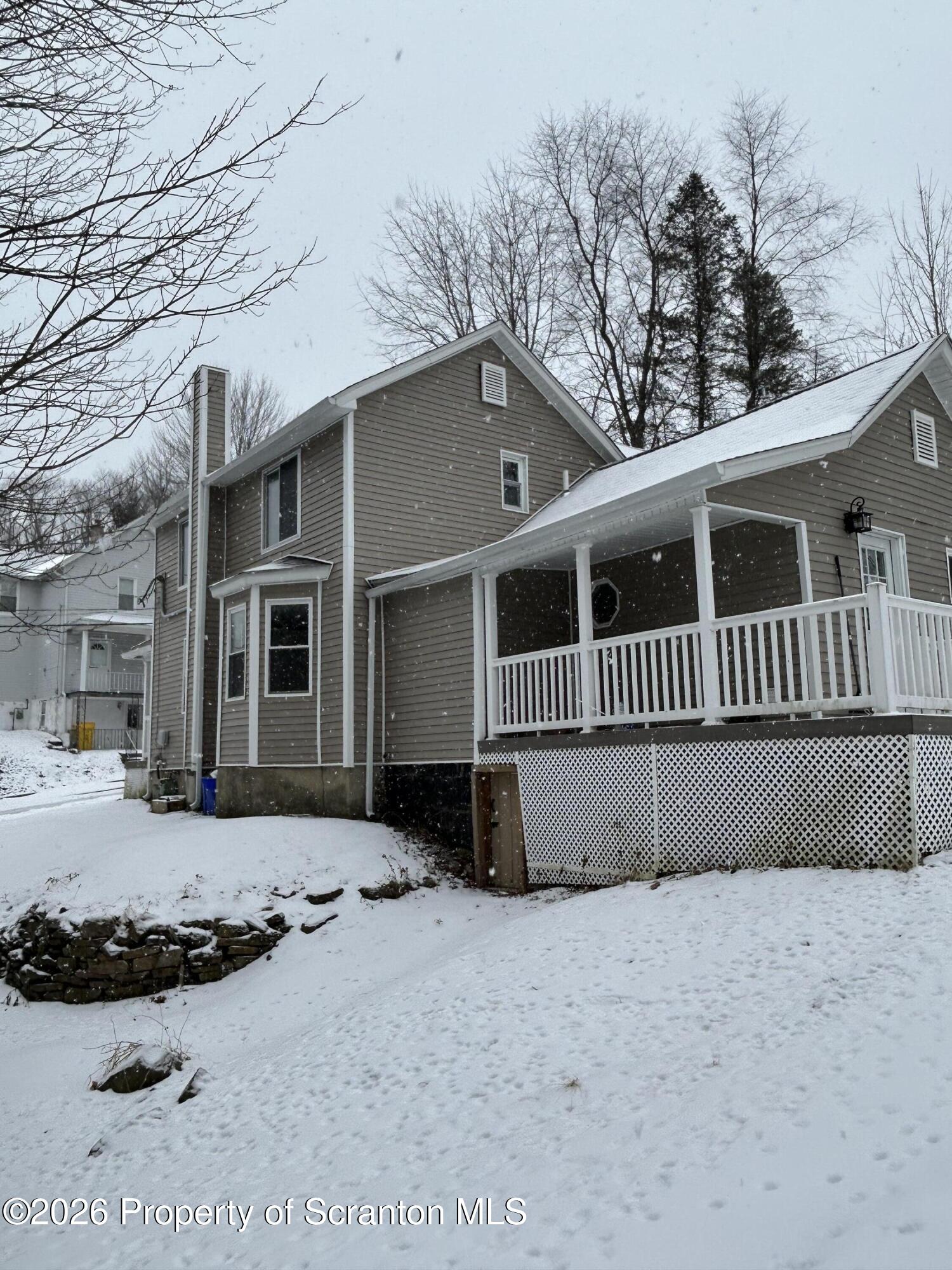 337 Wayne Street Archbald, PA 18403 - Photo 4 of 26 a front view of a house with a yard