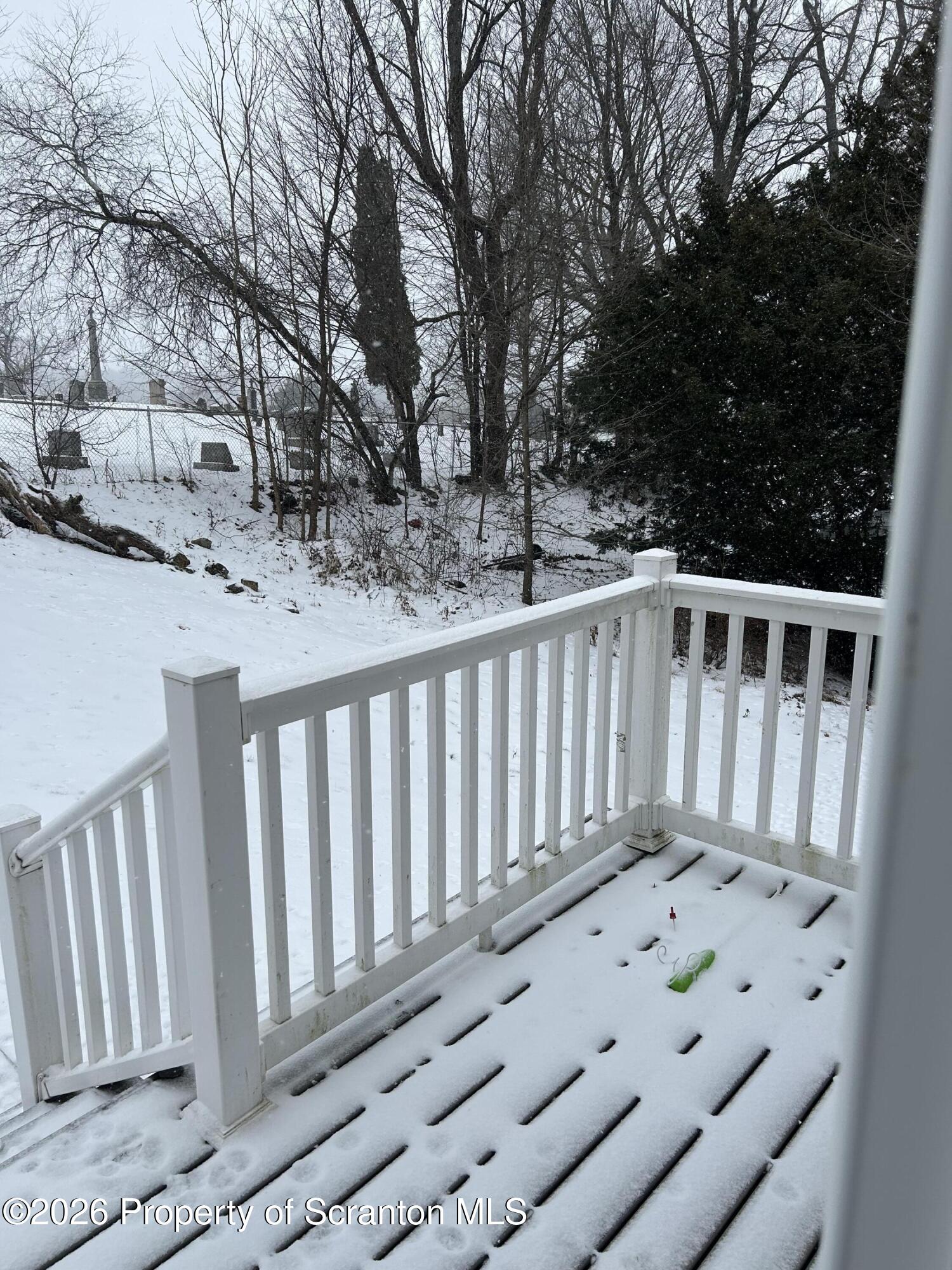 337 Wayne Street Archbald, PA 18403 - Photo 5 of 26 a view of a wooden fence