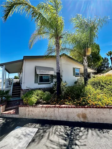 a front view of house with a yard